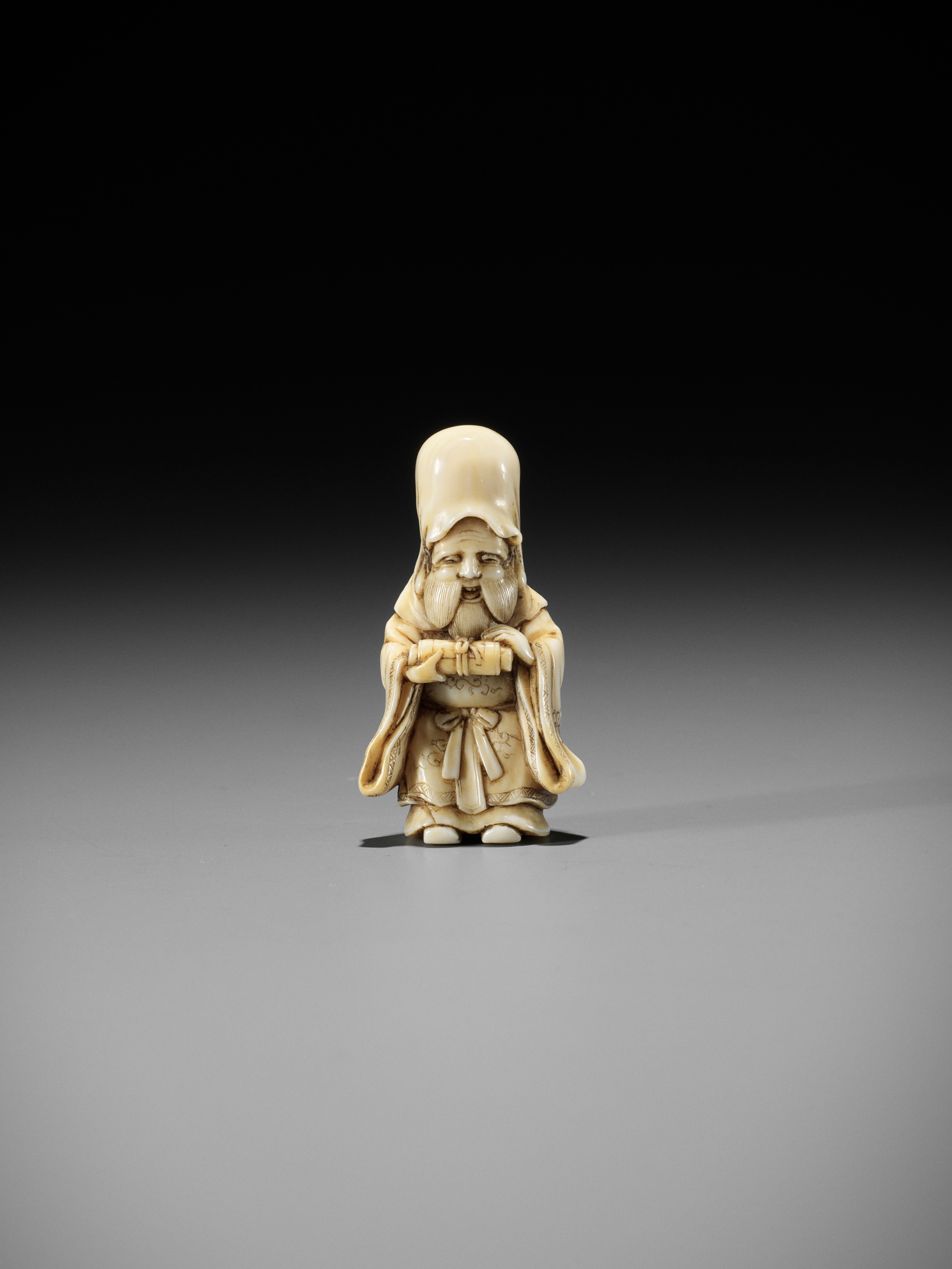 GYOKKOSAI: A FINE IVORY NETSUKE OF JUROJIN HOLDING A SCROLL - Image 9 of 13