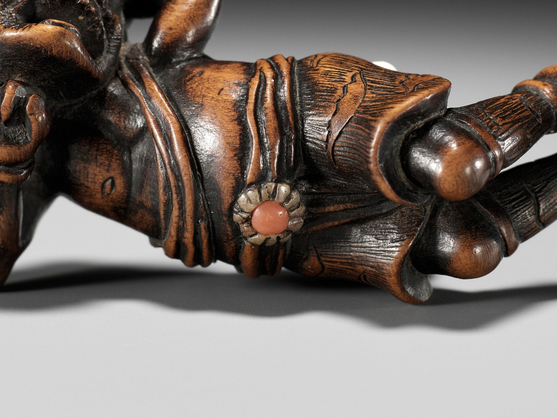 AN INLAID WOOD NETSUKE OF A RECLINING ONI AT SETSUBUN - Image 10 of 10