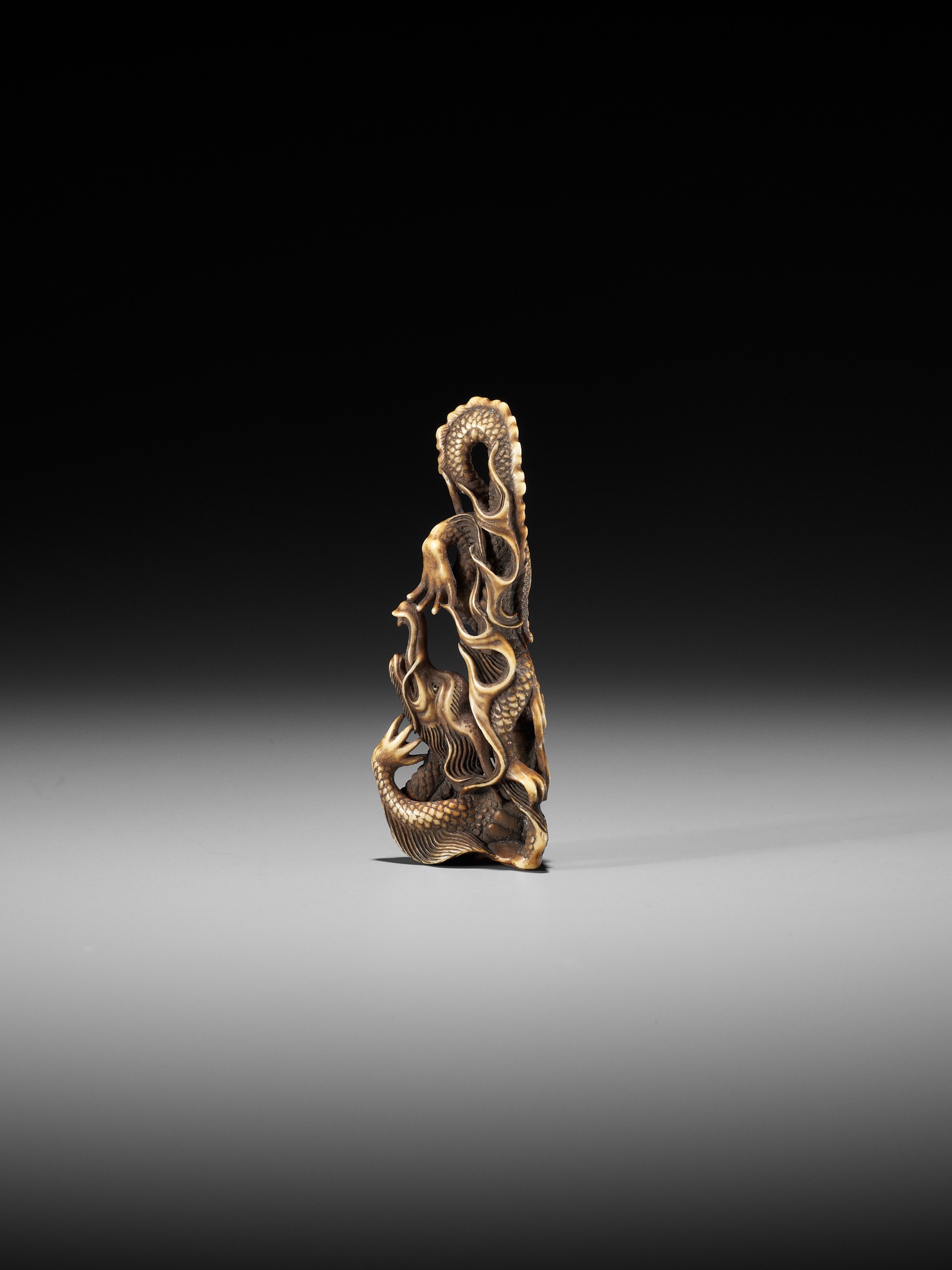 ITTO: A RARE OBIDOME-FORM IVORY NETSUKE OF A WRITHING RAIN DRAGON - Image 3 of 13