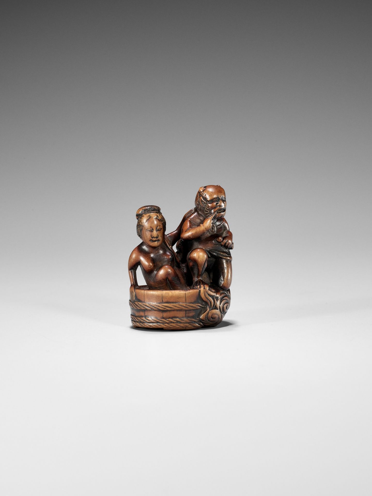 HOMIN: A GOOD WOOD NETSUKE OF RAIJIN WITH BATHING WOMAN - Image 8 of 11