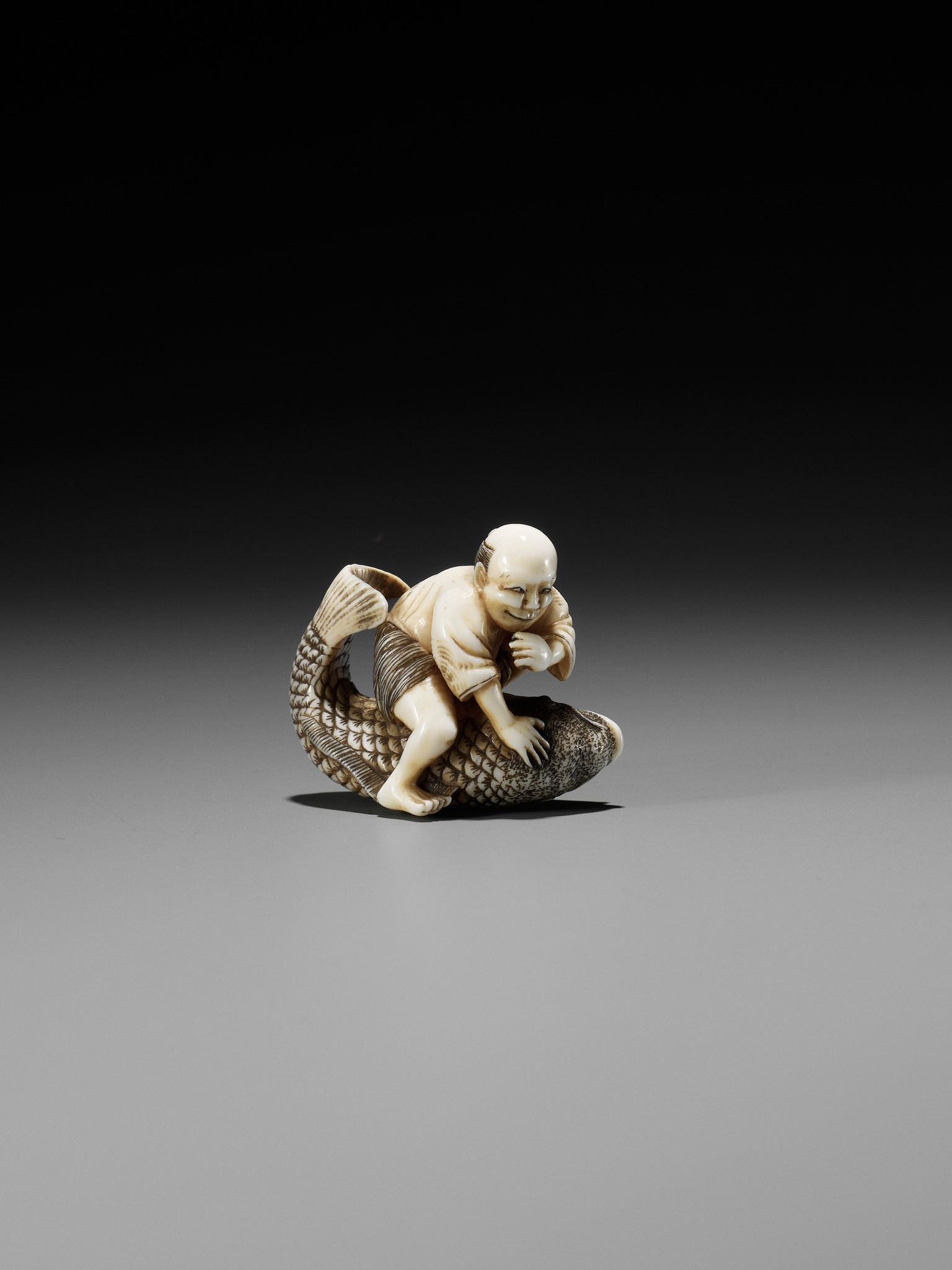 MASAMINE: A FINE OSAKA SCHOOL IVORY NETSUKE OF A FISHERMAN STRUGGLING WITH A HUGE CARP - Image 6 of 14