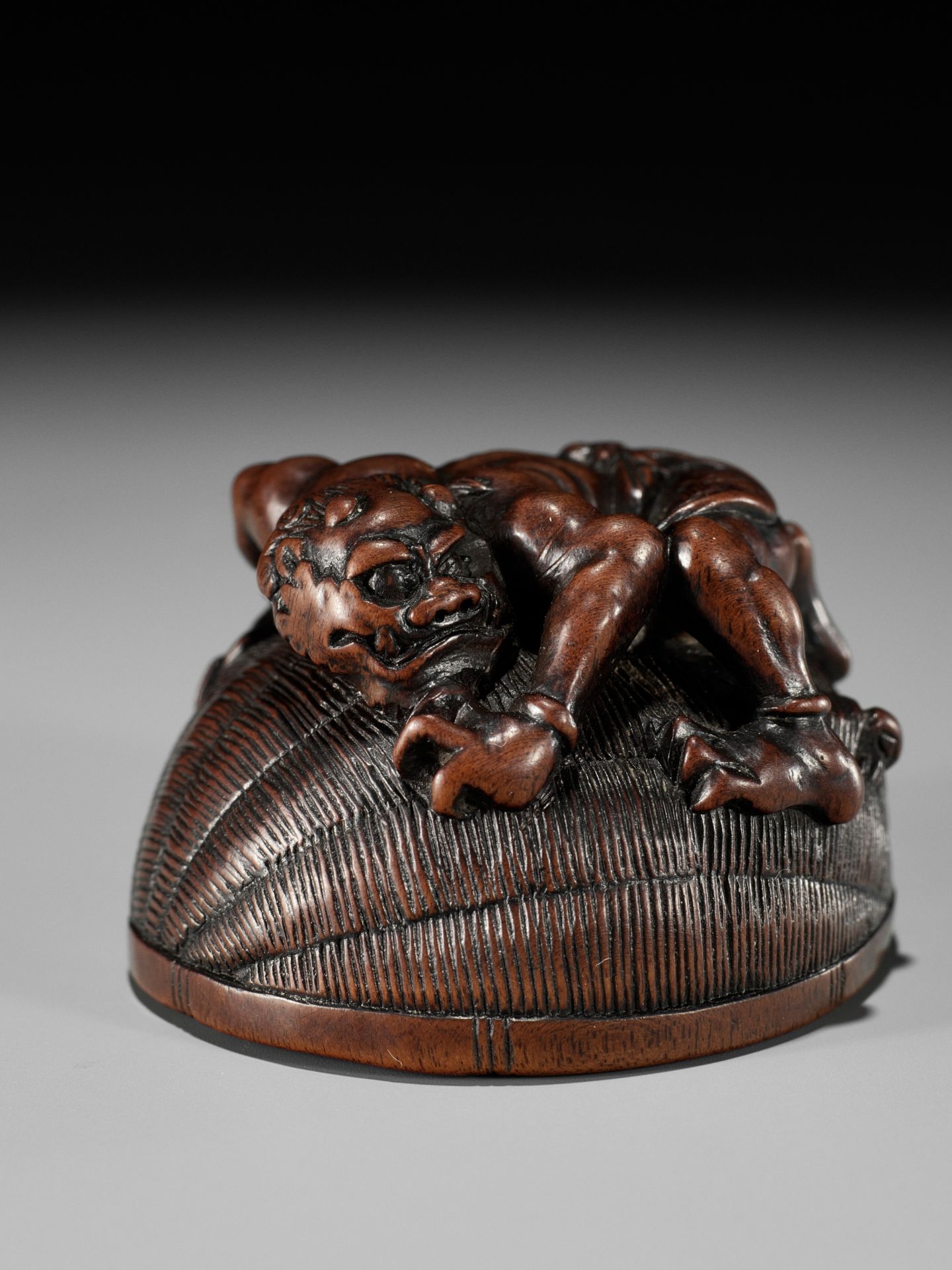 MASANAO: A RARE WOOD NETSUKE OF AN ONI TRAPPING SHOKI - Image 8 of 14