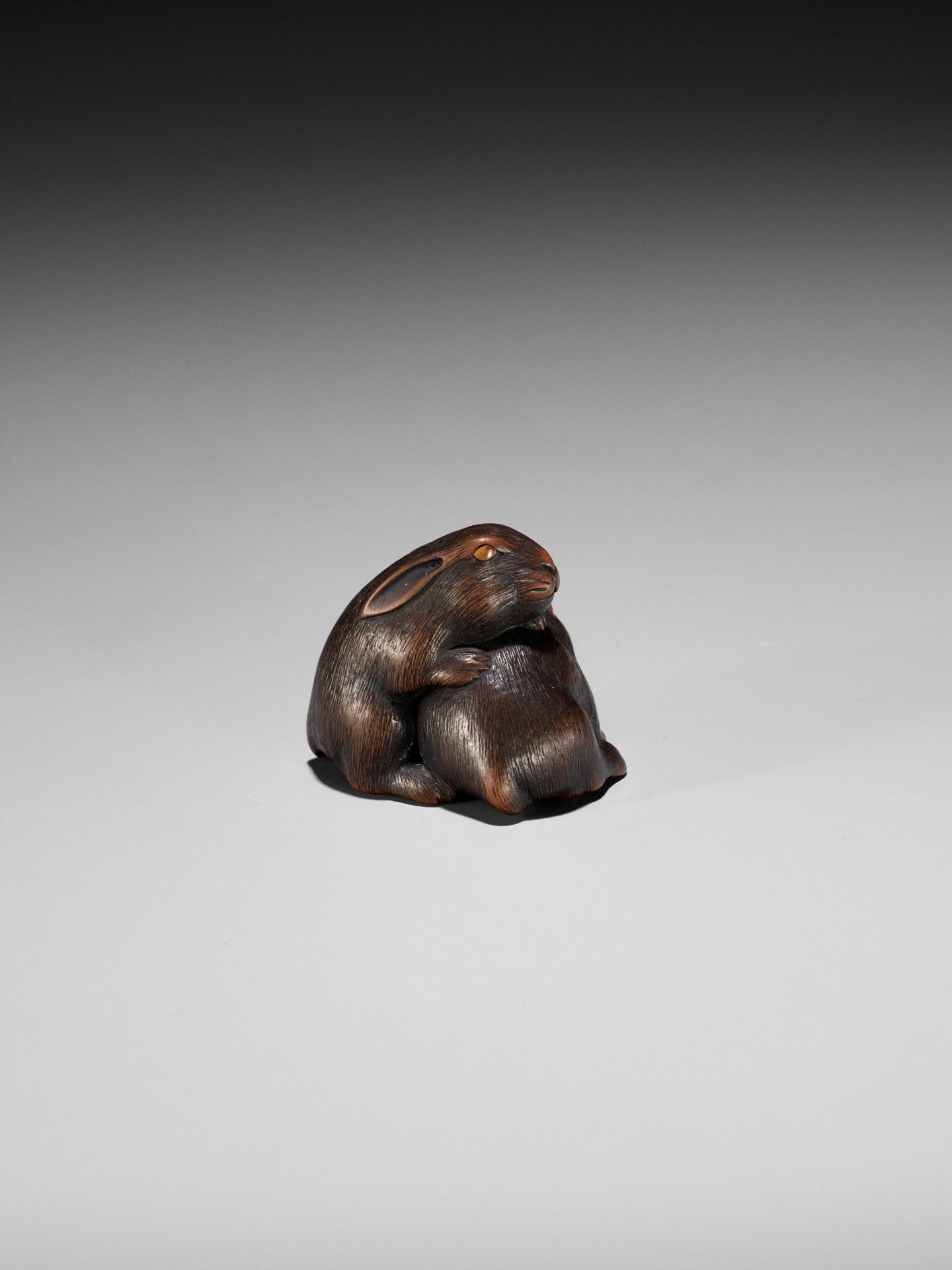 MASATADA: A FINE WOOD NETSUKE OF TWO RABBITS WITH AMBER EYES - Image 8 of 11