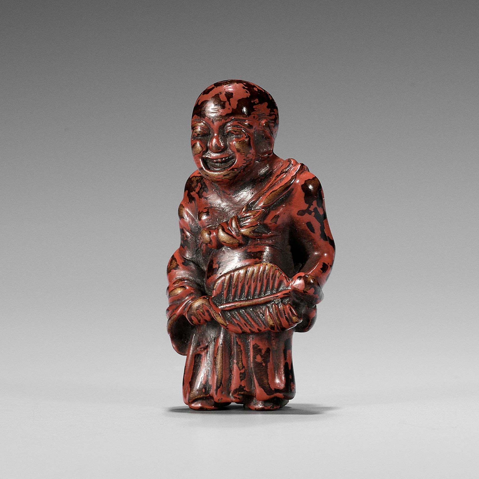 A NEGORO LACQUER NETSUKE OF HOTEI