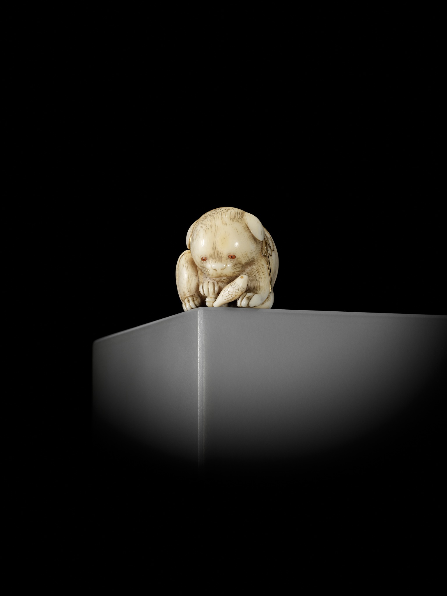 KAIGYOKUSAI MASATSUGU: A SUPERB IVORY NETSUKE OF A PUPPY WITH TOY BIRD - Image 6 of 16