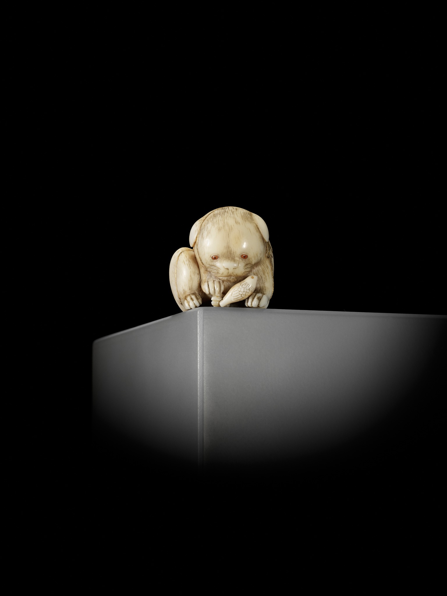 KAIGYOKUSAI MASATSUGU: A SUPERB IVORY NETSUKE OF A PUPPY WITH TOY BIRD - Image 13 of 16