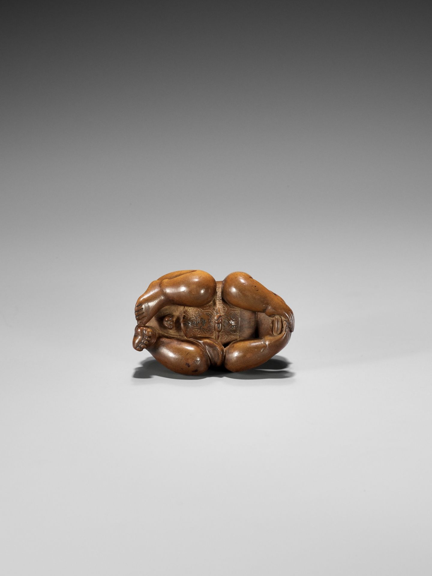 CHIKUUNSAI: A WOOD NETSUKE OF A BABY BOY EATING MOCHI - Image 11 of 12