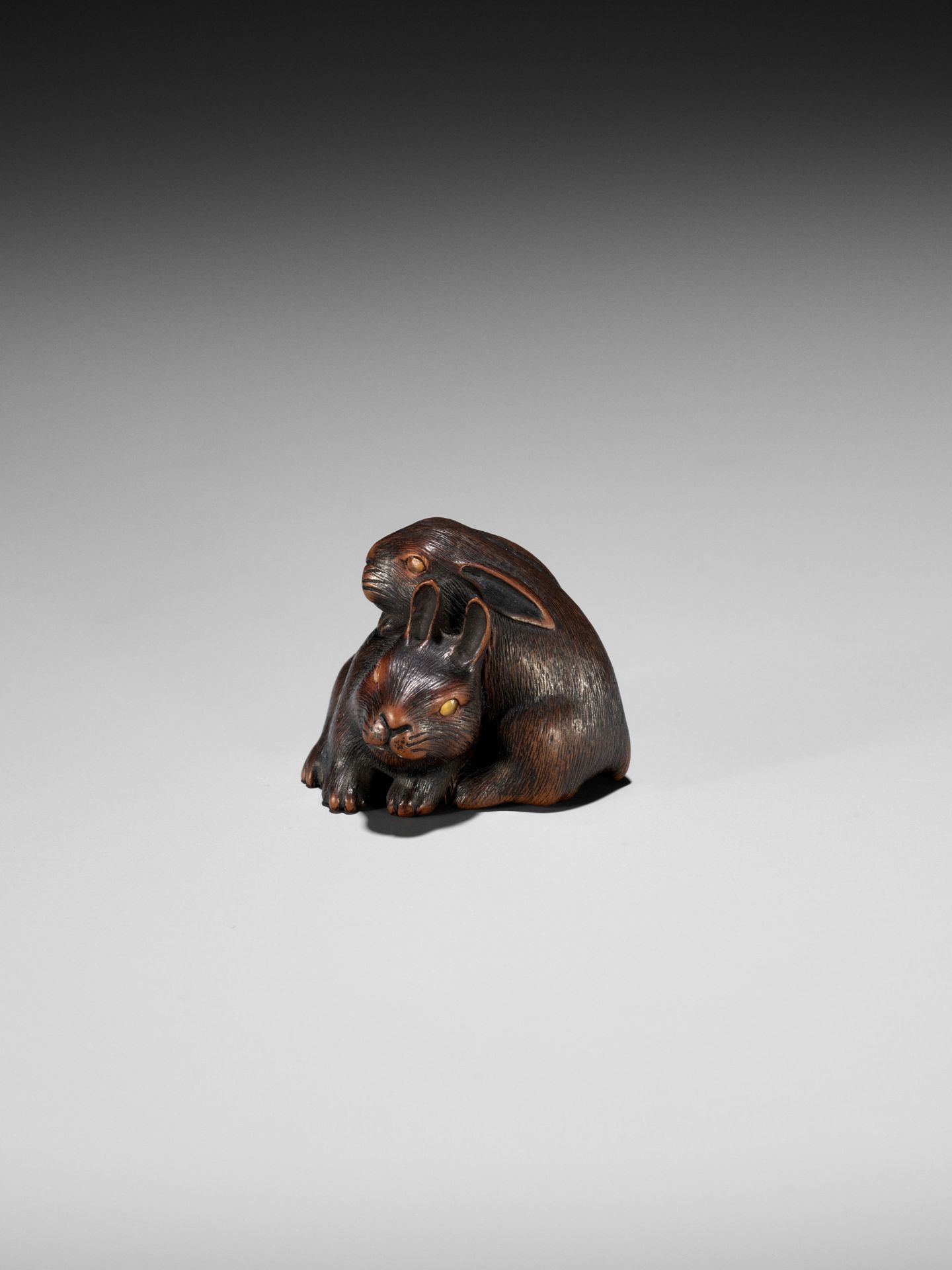 MASATADA: A FINE WOOD NETSUKE OF TWO RABBITS WITH AMBER EYES - Image 4 of 11