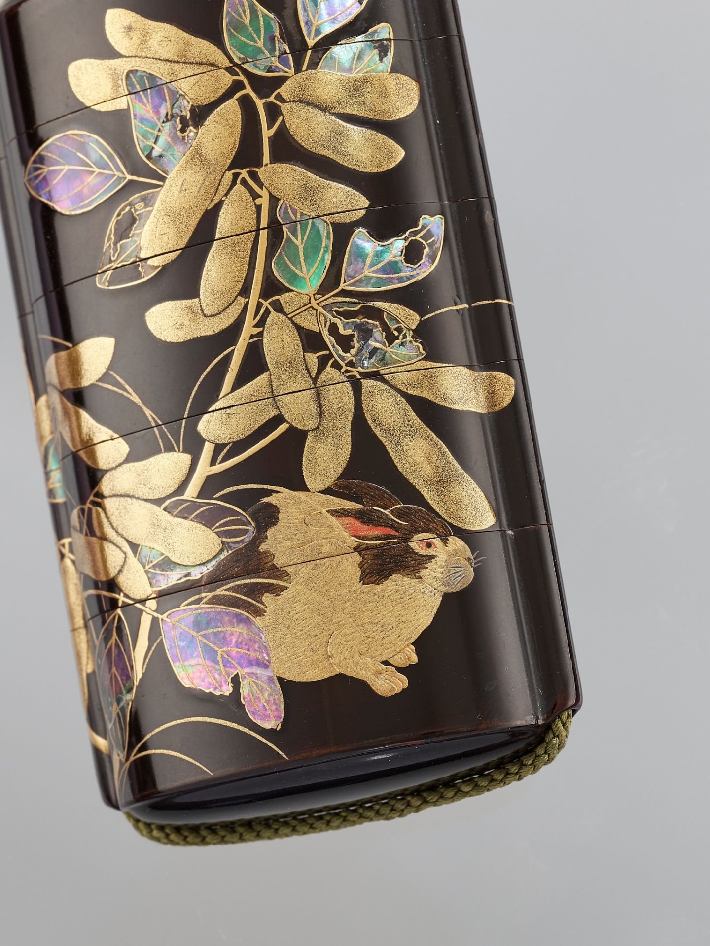 SHIOMI MASANARI: A FINE INLAID BLACK LACQUER FOUR-CASE INRO DEPICTING A RABBIT AND SILVER MOON