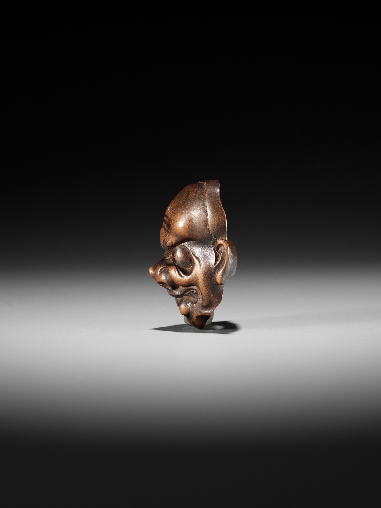 KOKEISAI SANSHO: A SUPERB STAINED WOOD MASK NETSUKE OF A GHOUL - Image 8 of 13