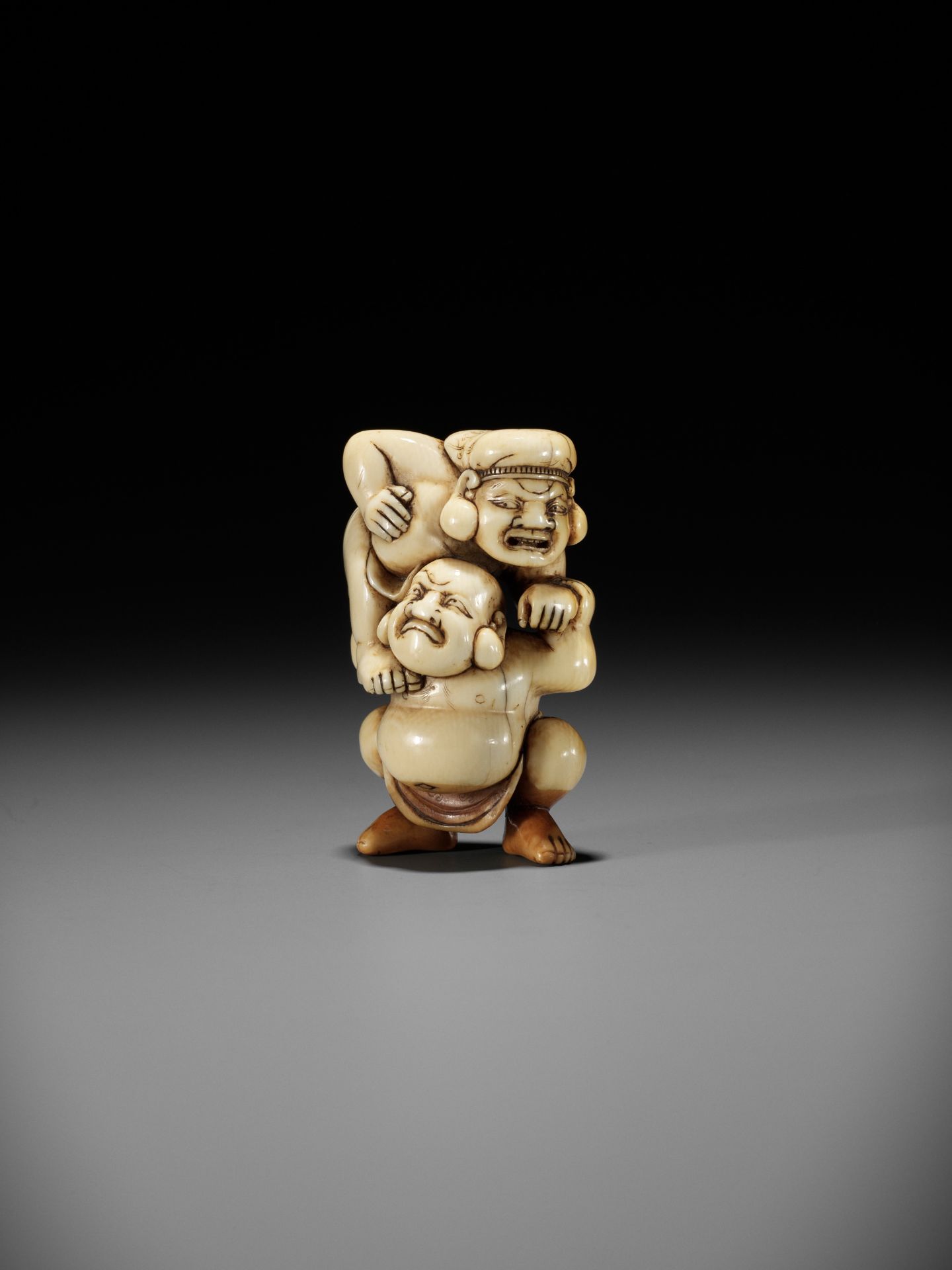 AN IVORY NETSUKE OF HOTEI AND DAIKOKU WRESTLING - Image 2 of 13