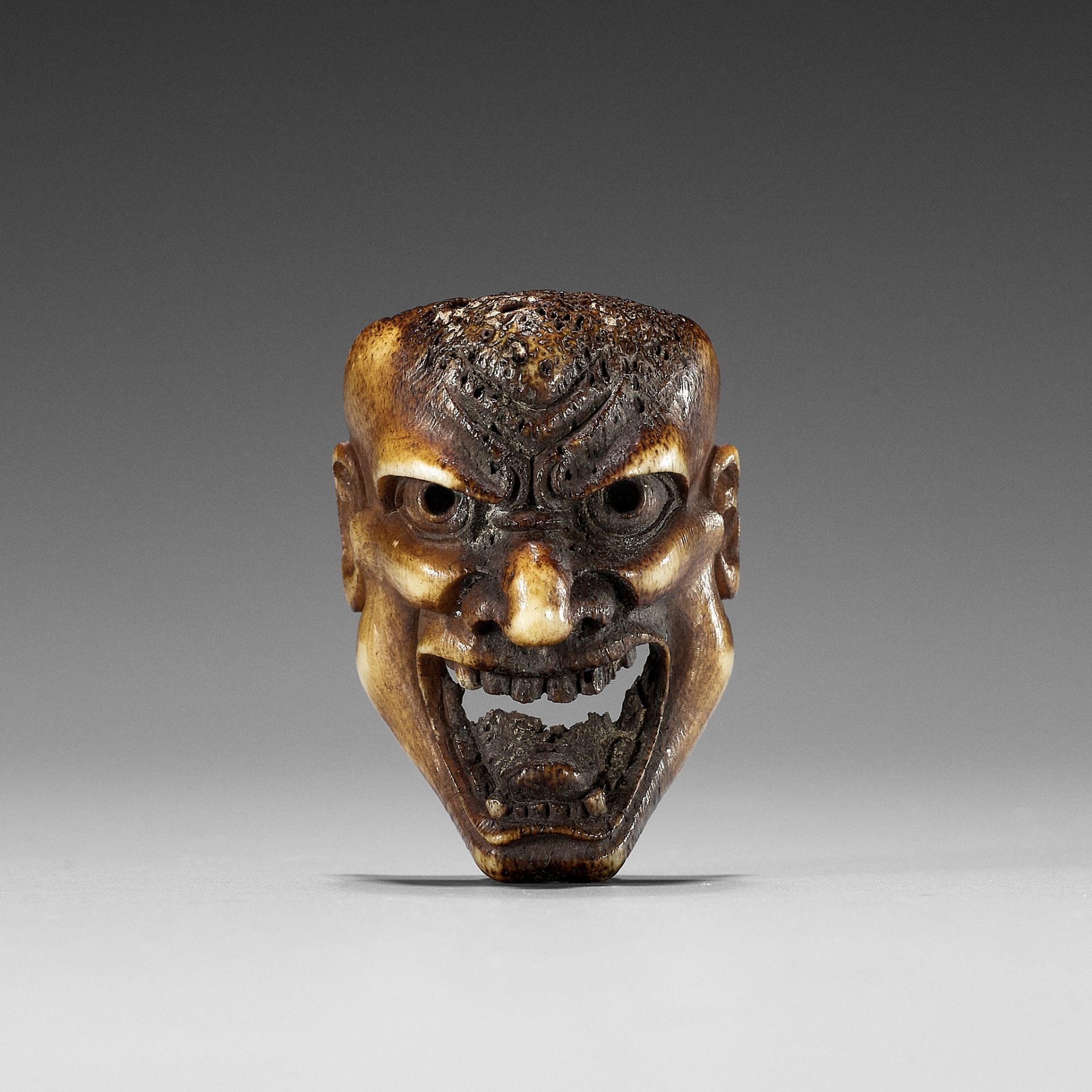 A SUPERB STAG ANTLER MASK NETSUKE OF HANNYA