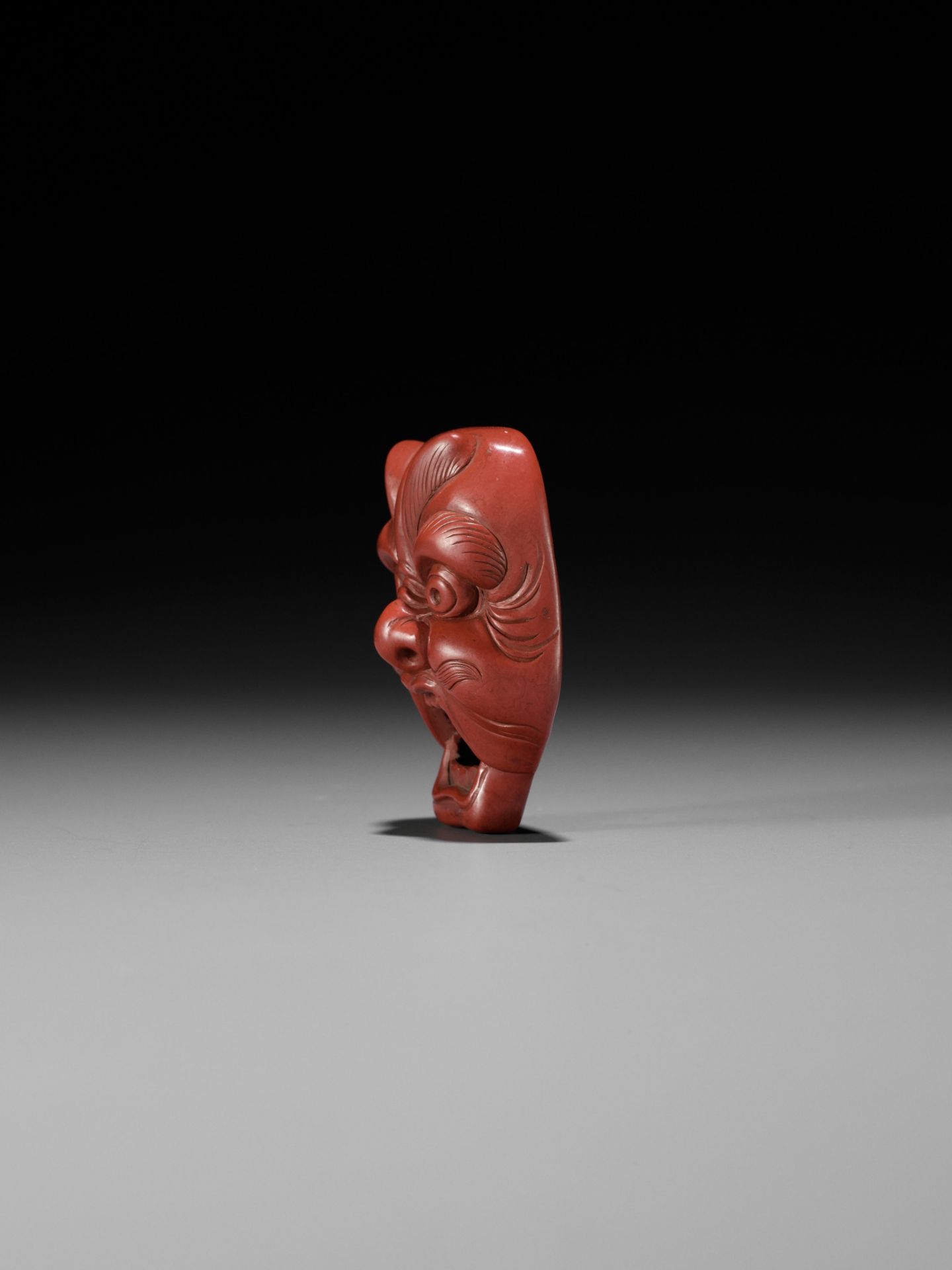 JOKO: A RARE TSUISHU (RED LACQUER) BUGAKU MASK NETSUKE OF GENJORAKU - Image 6 of 12