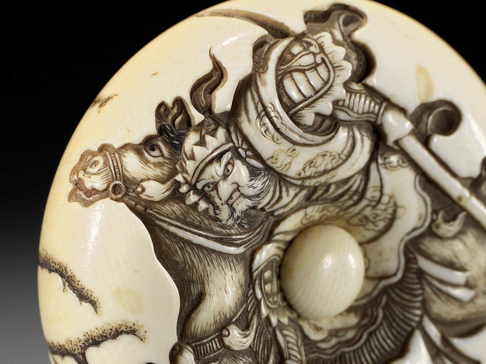 KOSAI MORITOSHI: A FINE IVORY MANJU NETSUKE DEPICTING GENTOKU ON HORSEBACK