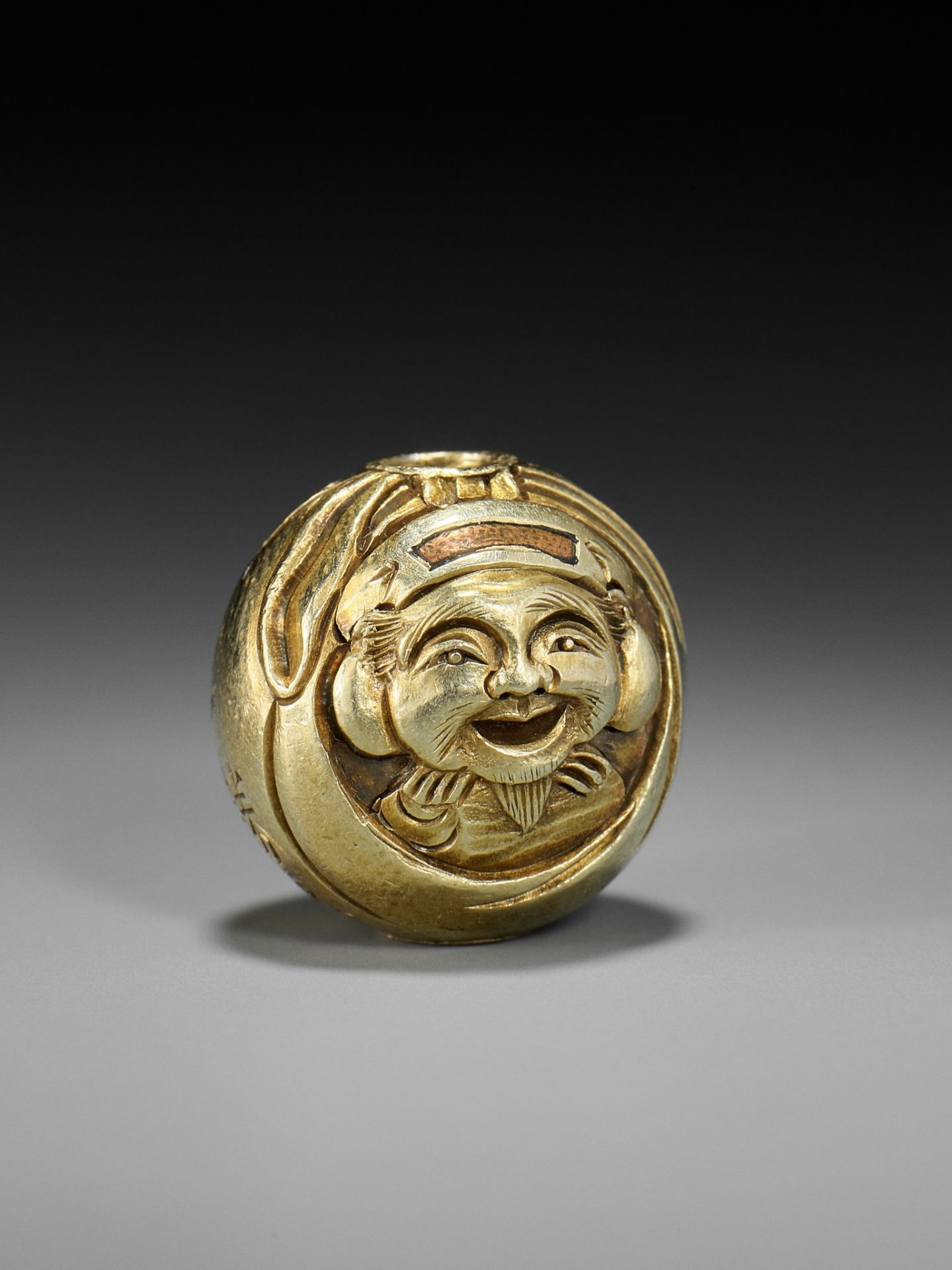 KATSUHIRA: A RARE GOLD OJIME DEPICTING DAIKOKU INSIDE HIS SACK