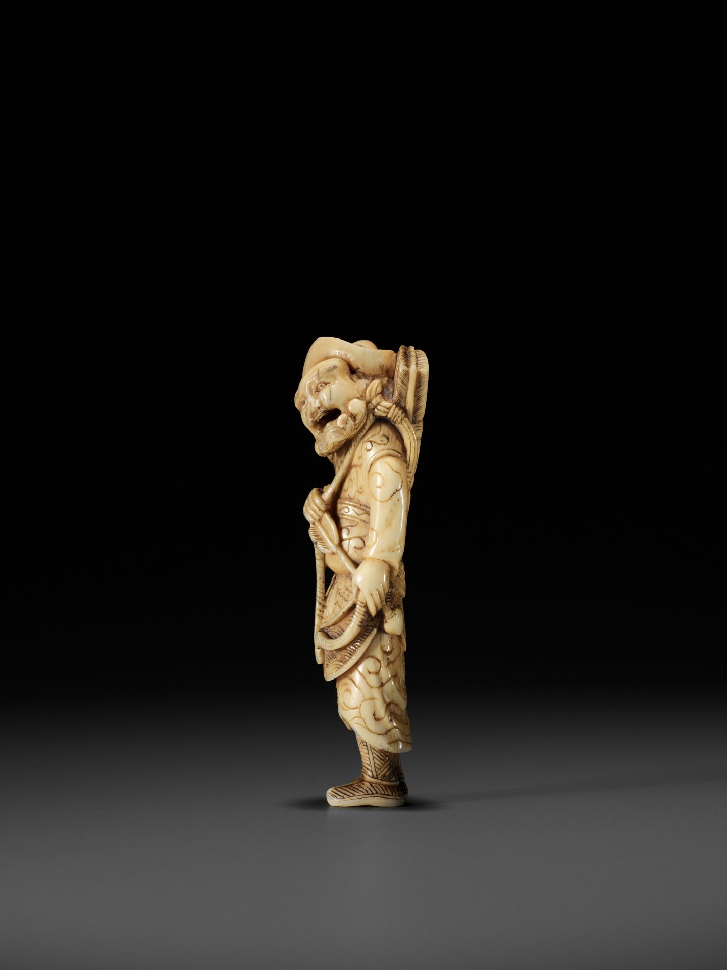 A POWERFUL TALL IVORY NETSUKE OF A TARTAR ARCHER - Image 7 of 11