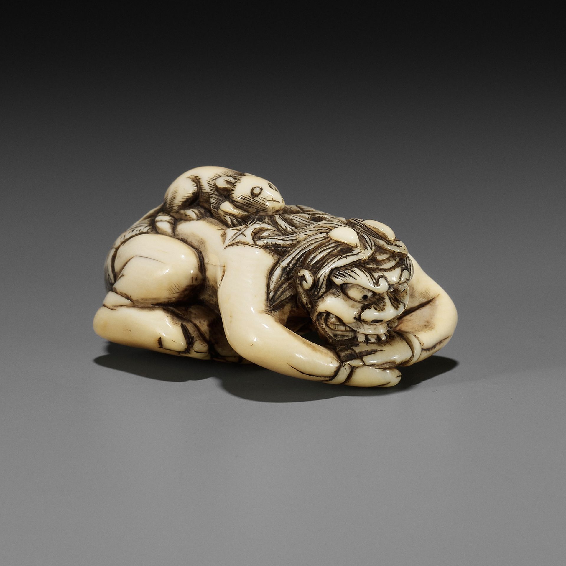 A RARE IVORY NETSUKE OF SHIRO