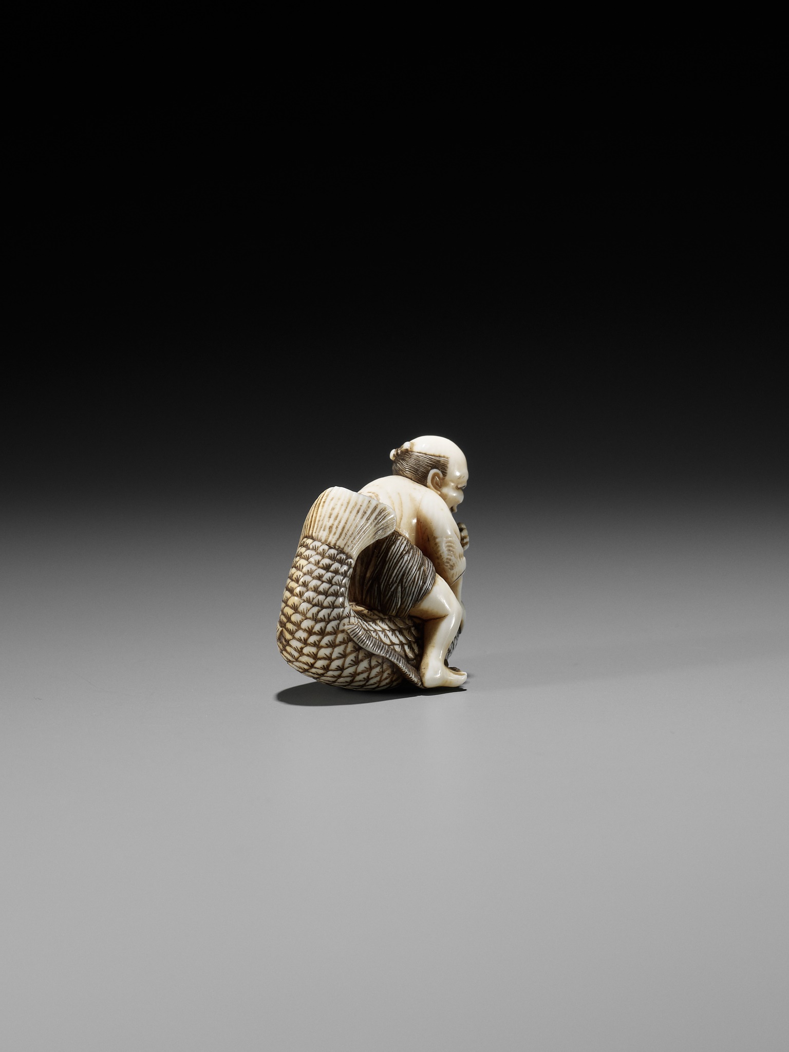 MASAMINE: A FINE OSAKA SCHOOL IVORY NETSUKE OF A FISHERMAN STRUGGLING WITH A HUGE CARP - Image 10 of 14