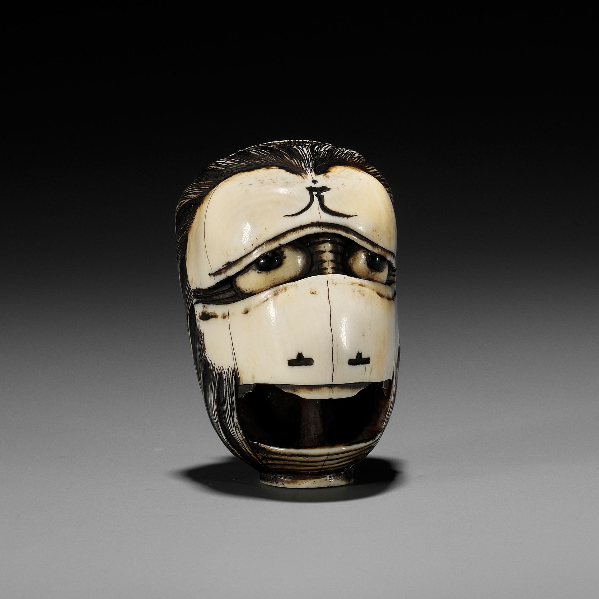 MITSUHIRO: A RARE AND IMPORTANT IVORY NETSUKE OF THE GHOST OF OIWA AS A CHOCHIN (LANTERN)