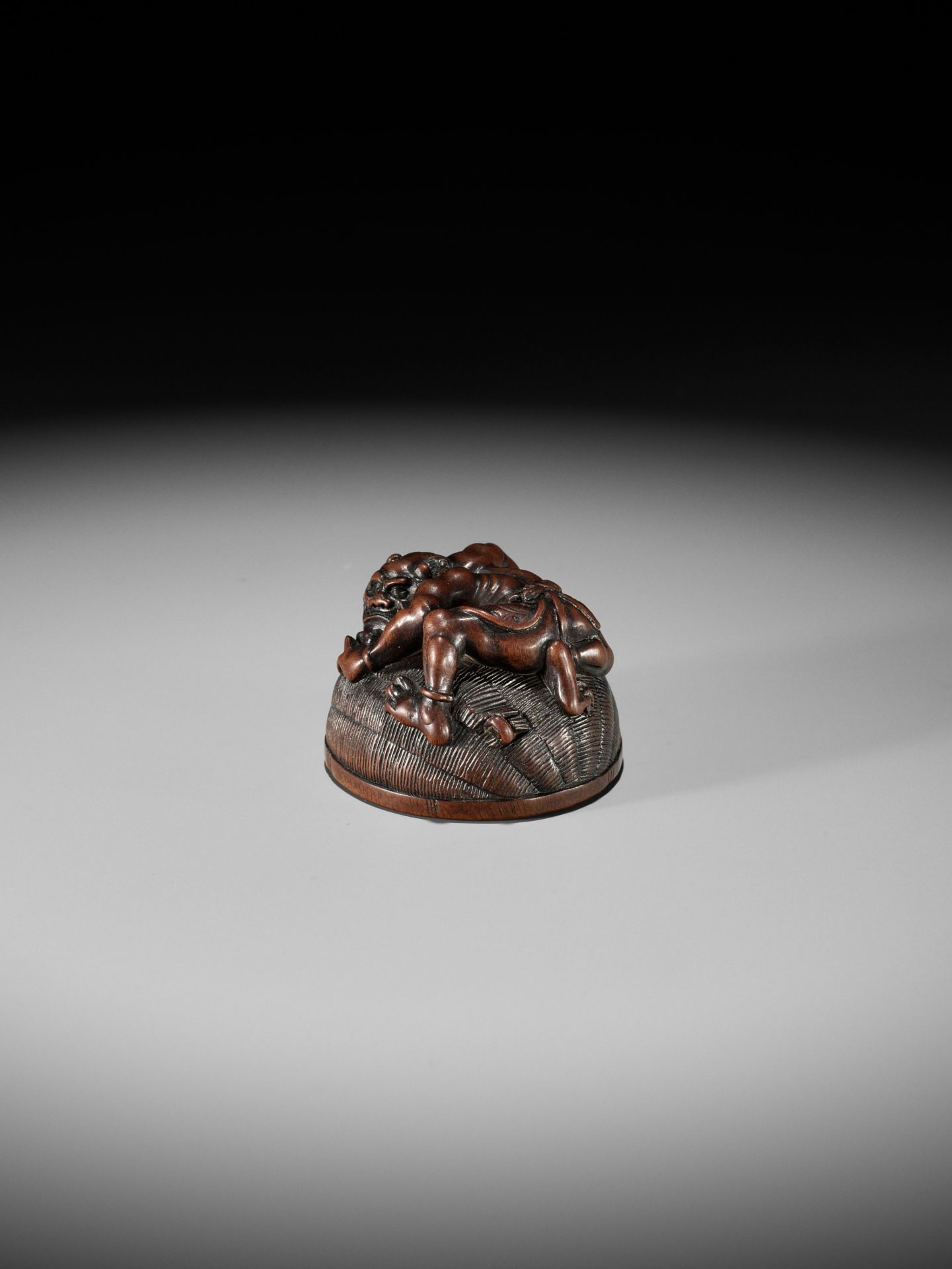 MASANAO: A RARE WOOD NETSUKE OF AN ONI TRAPPING SHOKI - Image 6 of 14