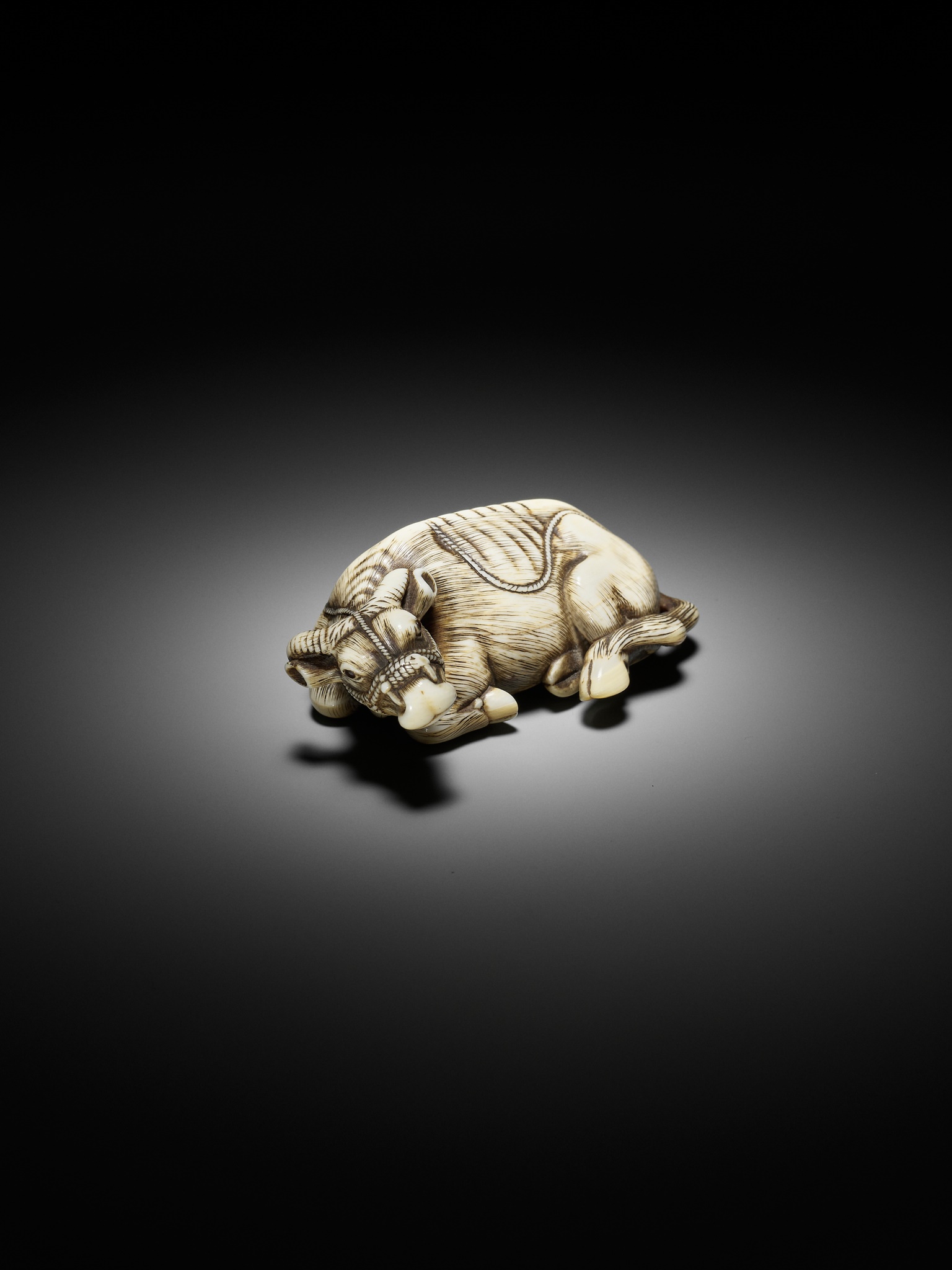 TOMOTADA: A SUPERB IVORY NETSUKE OF A RECUMBENT COW - Image 12 of 18