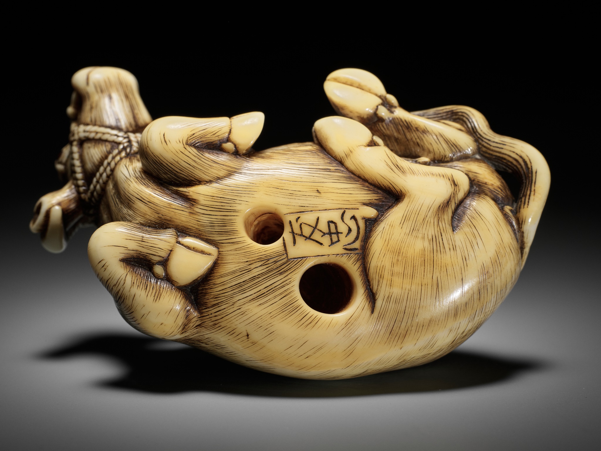 TOMOTADA: A SUPERB IVORY NETSUKE OF A RECUMBENT COW - Image 17 of 18