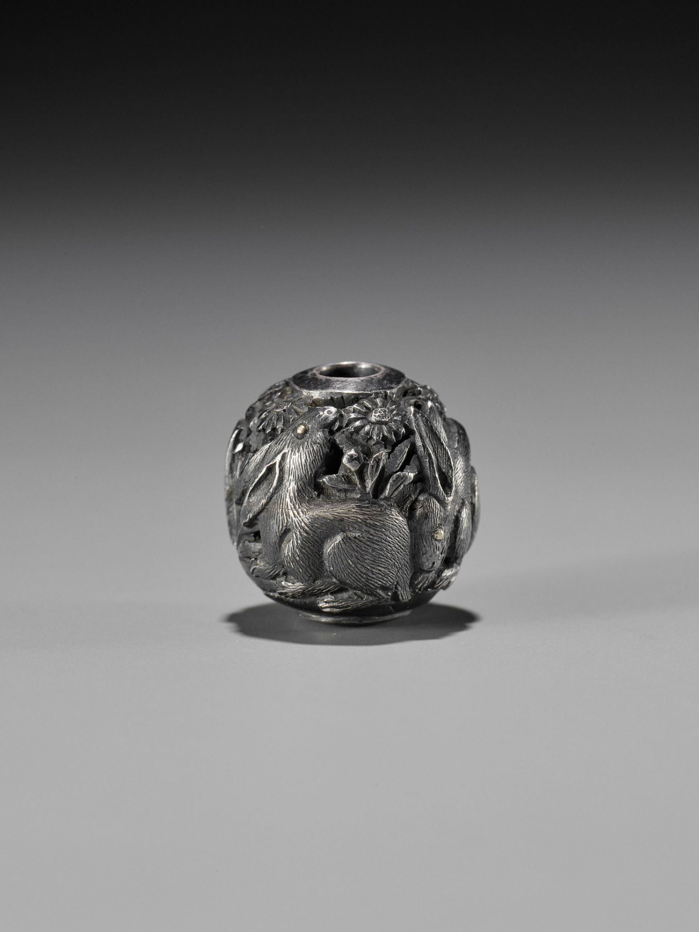 MASAKAZU: A FINE SILVER OJIME DEPICTING THREE HARES