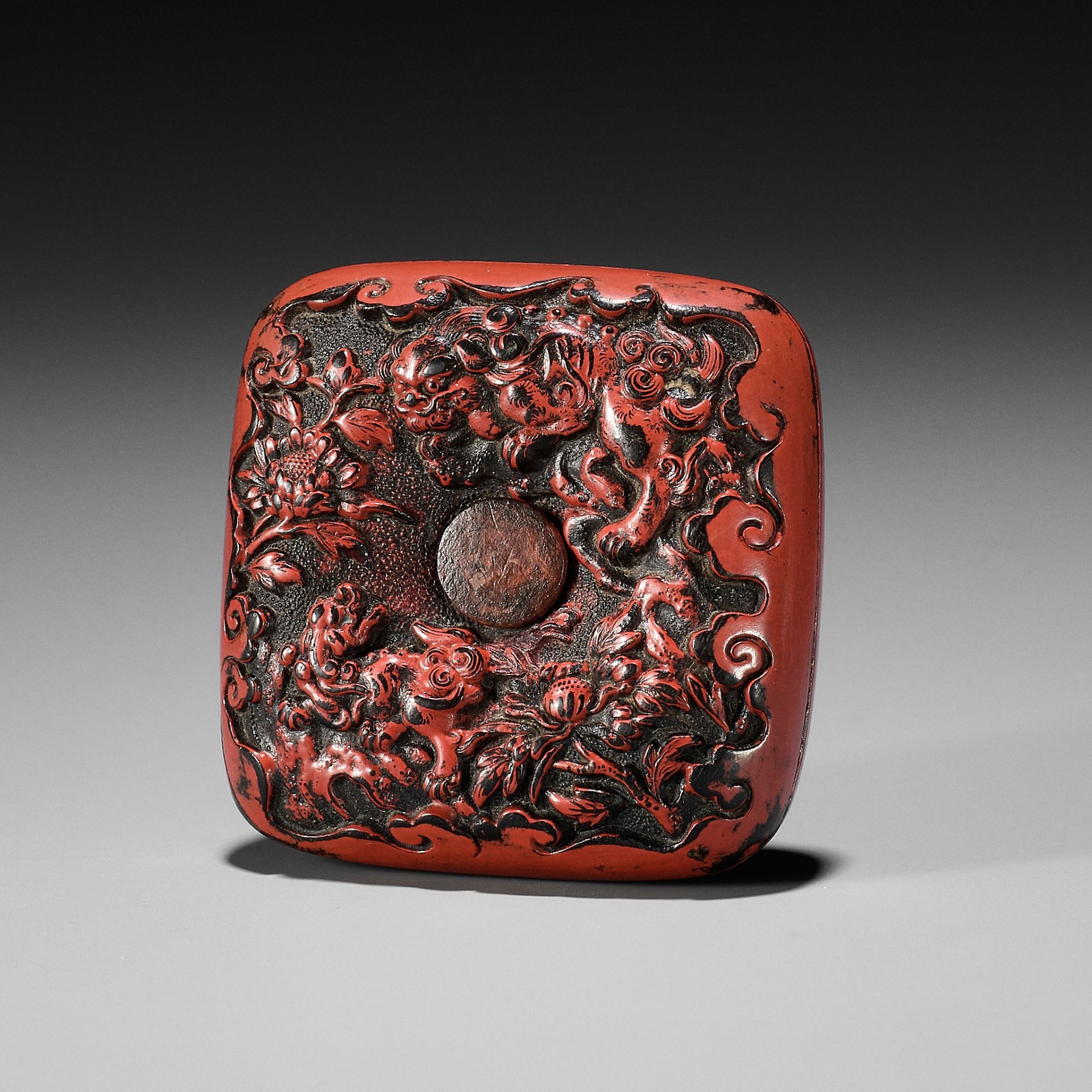 A NEGORO LACQUER NETSUKE DEPICTING SHISHI NO SAKA OTOSHI