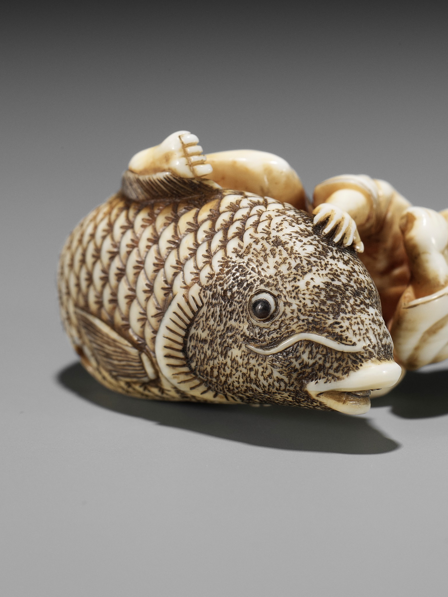 MASAMINE: A FINE OSAKA SCHOOL IVORY NETSUKE OF A FISHERMAN STRUGGLING WITH A HUGE CARP - Image 2 of 14