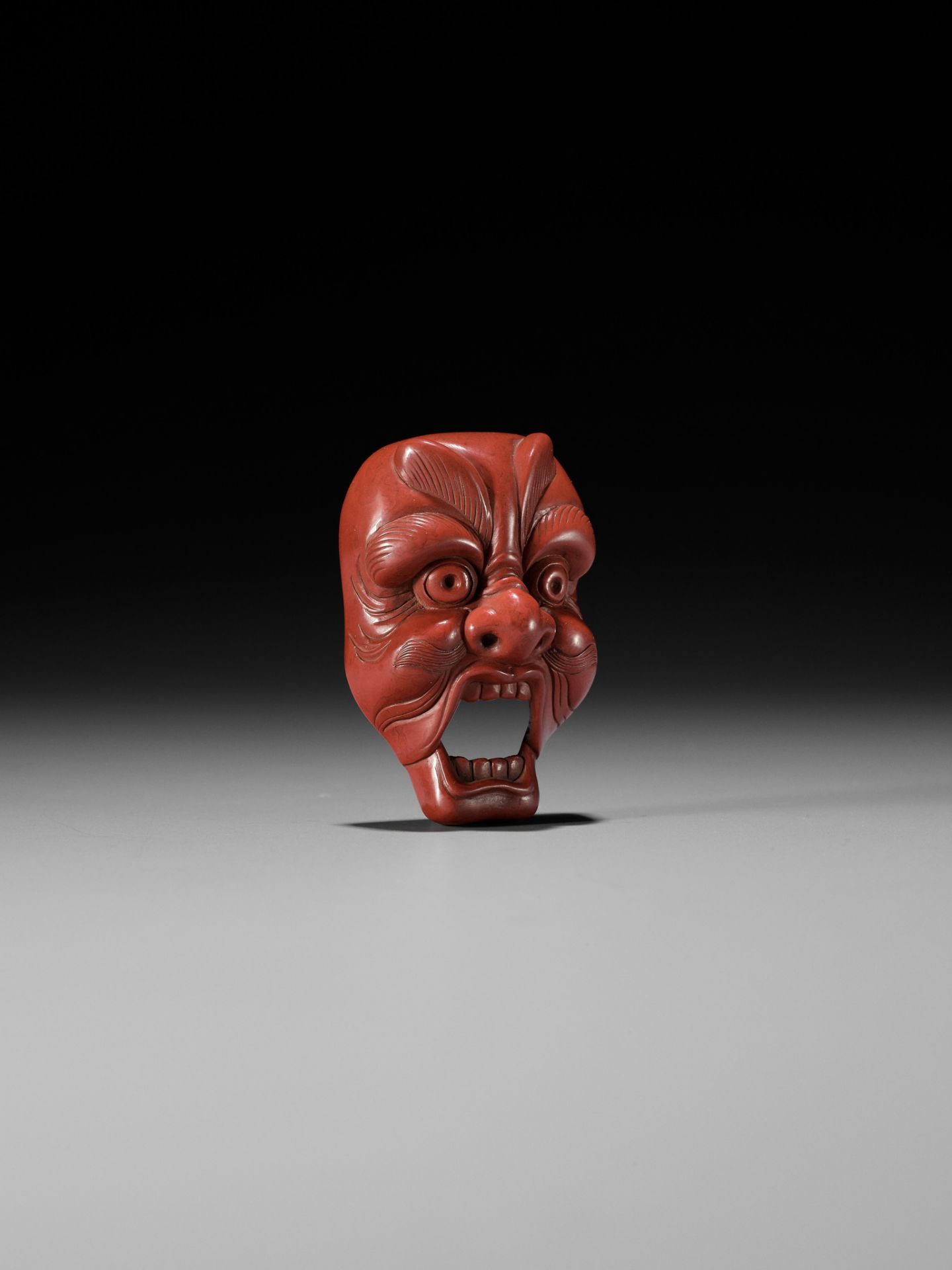 JOKO: A RARE TSUISHU (RED LACQUER) BUGAKU MASK NETSUKE OF GENJORAKU - Image 3 of 12