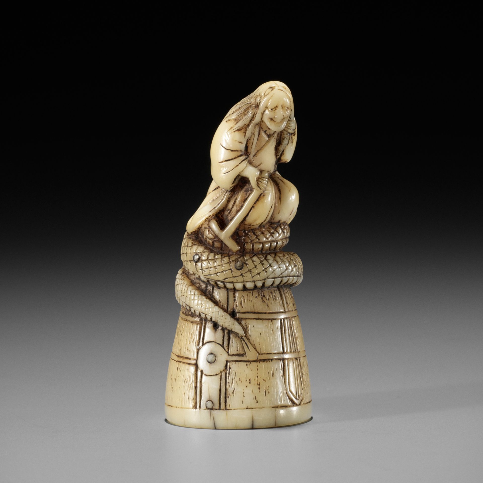 A RARE MARINE TOOTH NETSUKE OF KIYOHIME