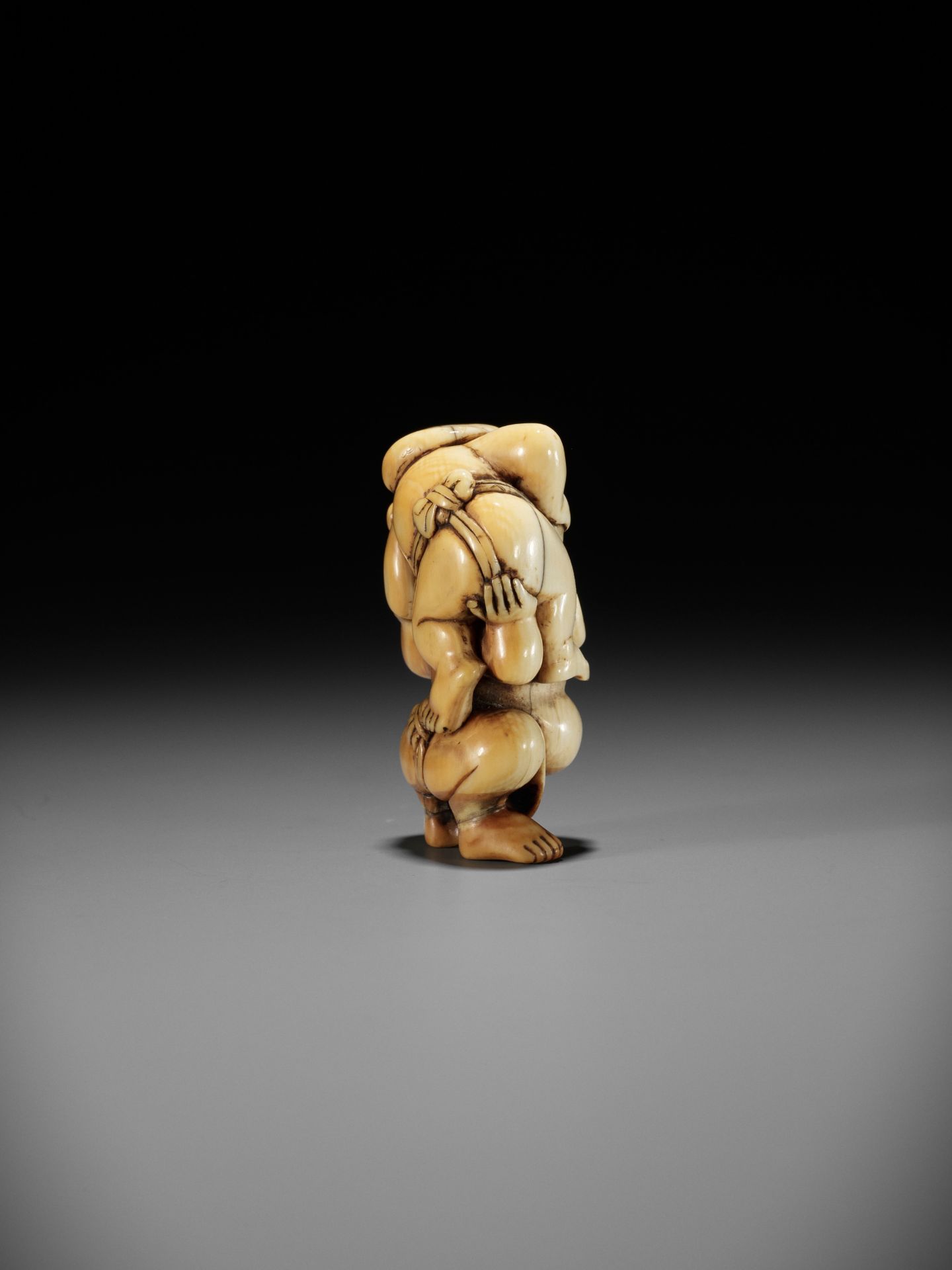 AN IVORY NETSUKE OF HOTEI AND DAIKOKU WRESTLING - Image 8 of 13