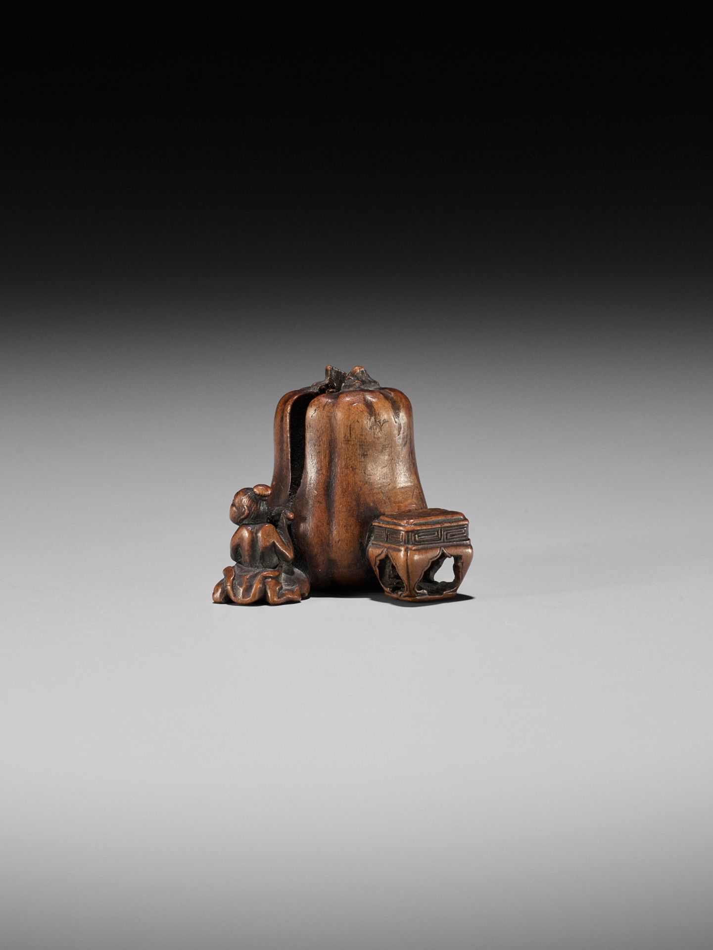 NAOYUKI: AN EXQUISITE MINIATURE WOOD NETSUKE OF A NIO CUTTING THROUGH A GIGANTIC GOURD - Image 4 of 9