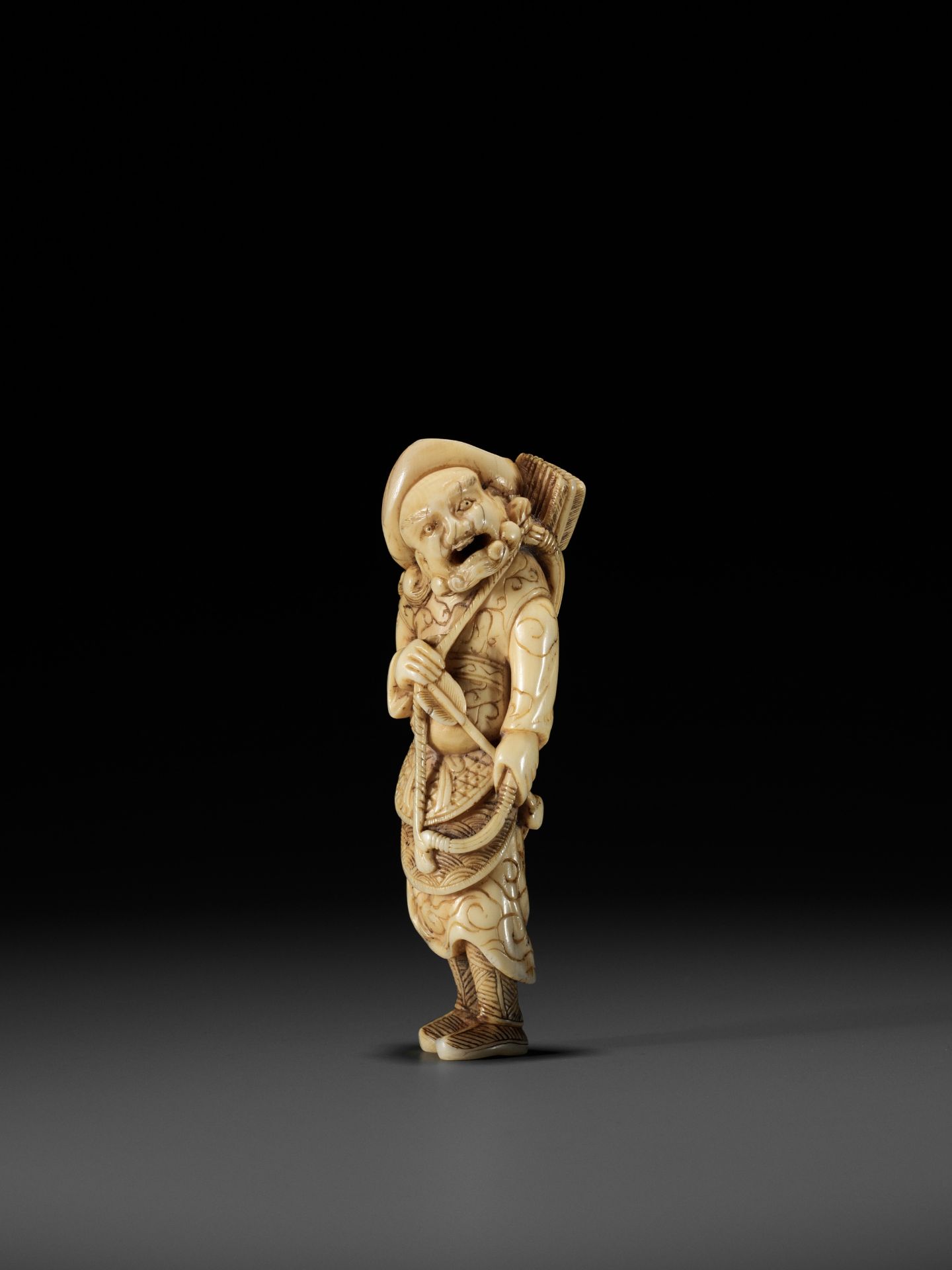 A POWERFUL TALL IVORY NETSUKE OF A TARTAR ARCHER - Image 6 of 11