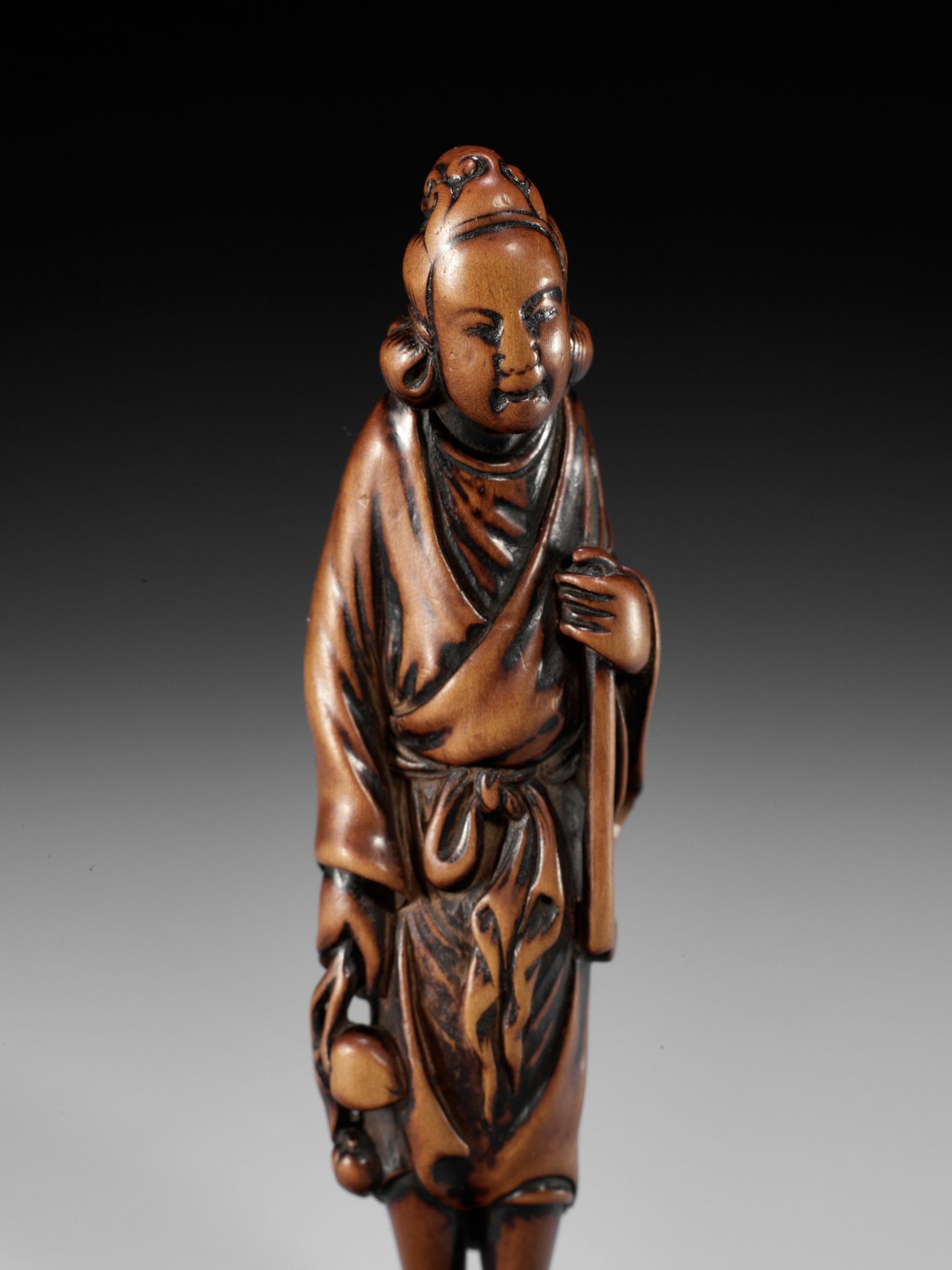 A SUPERB TALL WOOD NETSUKE OF SEIOBO