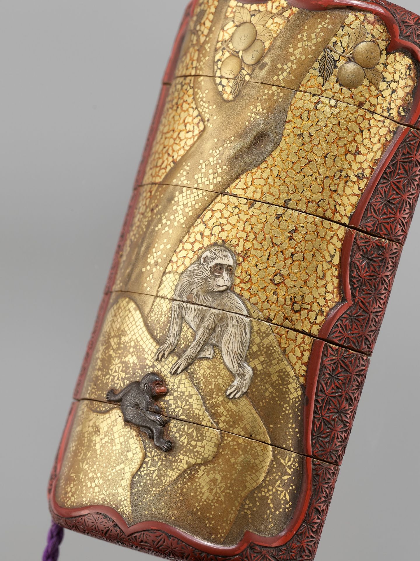 AN UNUSUAL INLAID GOLD LACQUER AND TSUISHU FOUR-CASE INRO WITH MONKEYS