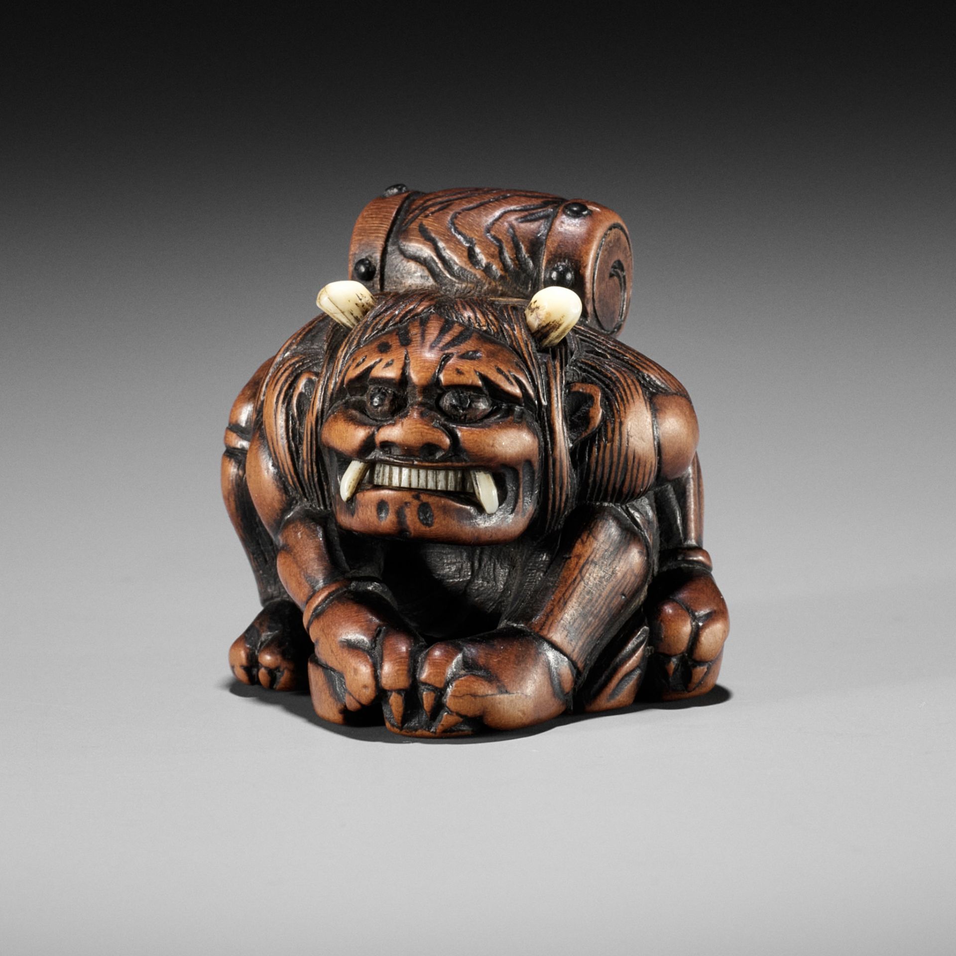 MASASADA: A POWERFUL WOOD NETSUKE OF RAIJIN WITH DRUM