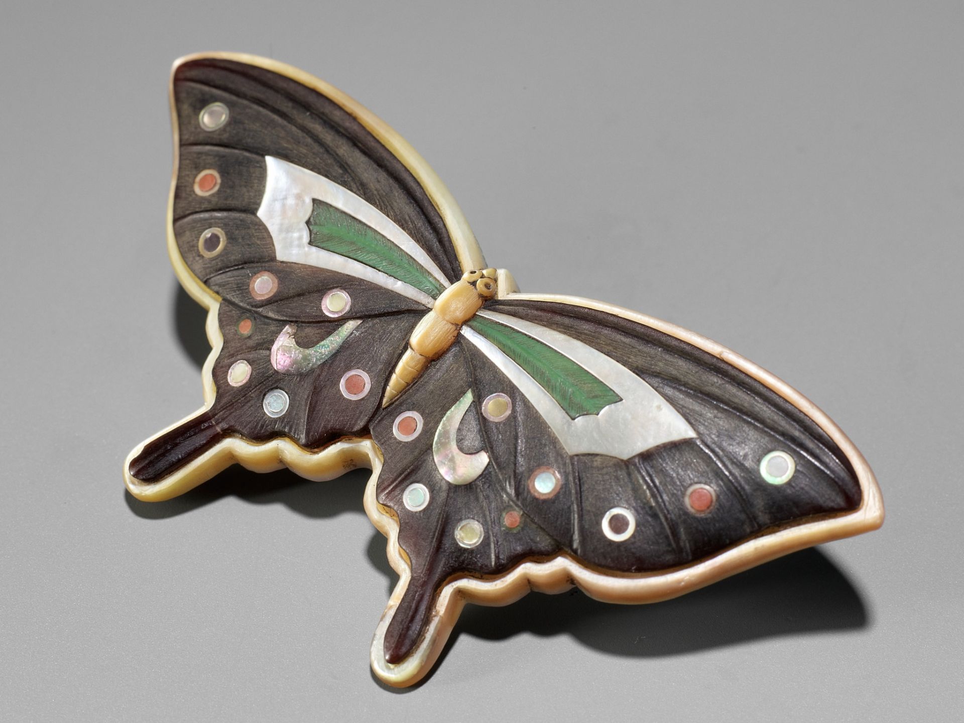 TOKOKU: A MASTERFUL MIXED MATERIAL NETSUKE OF A BUTTERFLY