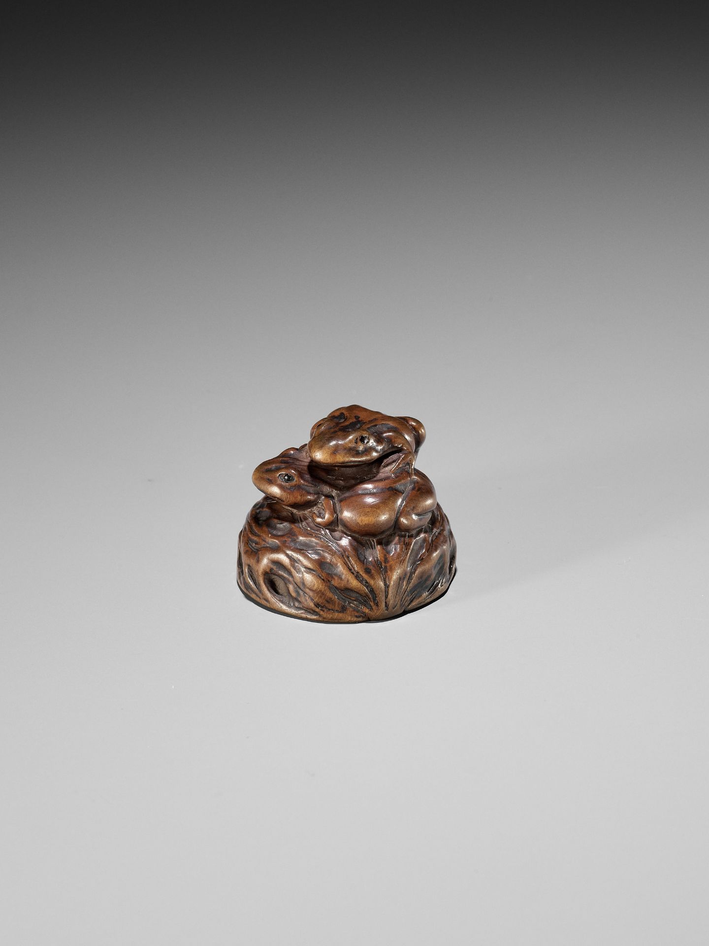 ISSAN: A WOOD NETSUKE OF TWO TOADS ON A WALNUT - Image 9 of 11