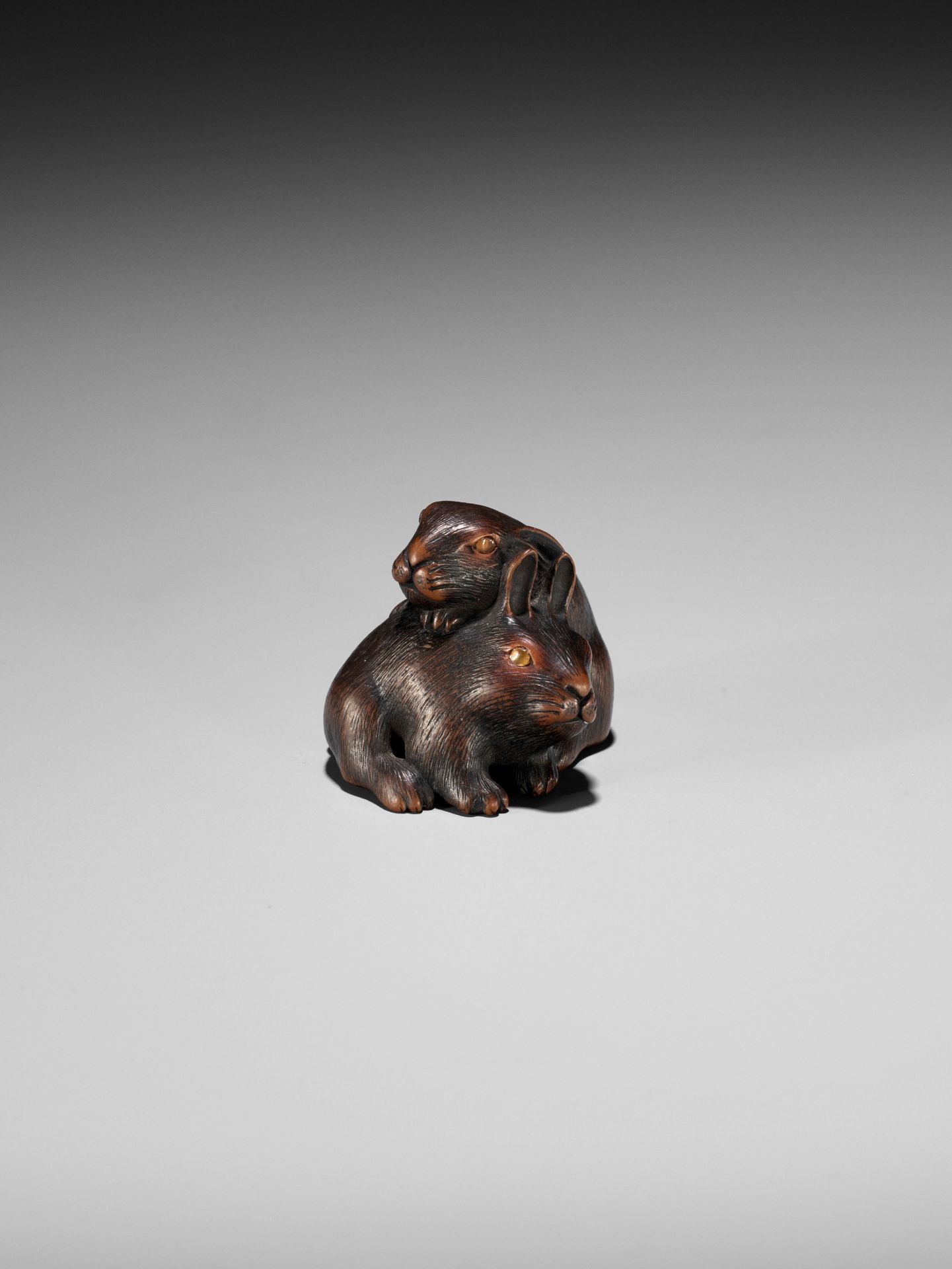 MASATADA: A FINE WOOD NETSUKE OF TWO RABBITS WITH AMBER EYES - Image 6 of 11