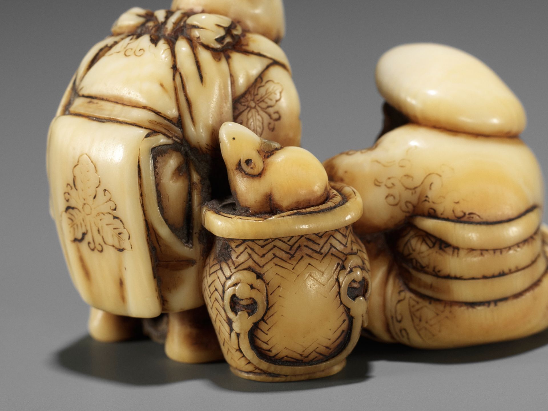 IKKOSAI: AN AMUSING IVORY SHUNGA NETSUKE OF DAIKOKU AND EBISU - Image 10 of 12