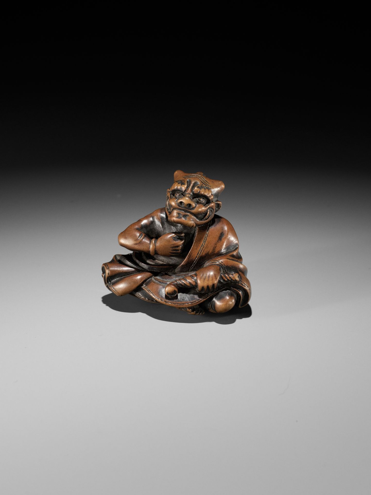 MASAYUKI: A FINE WOOD NETSUKE OF A SMOKING ONI - Image 3 of 11