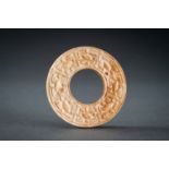 A SMALL OCHRE JADE ARCHAISTIC BI DISC, QING