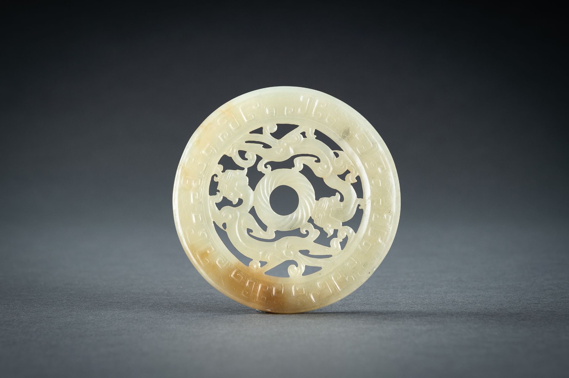 AN ARCHAISTIC YELLOW JADE RETICULATED 'CHILONG' BI DISC, QING - Image 3 of 15