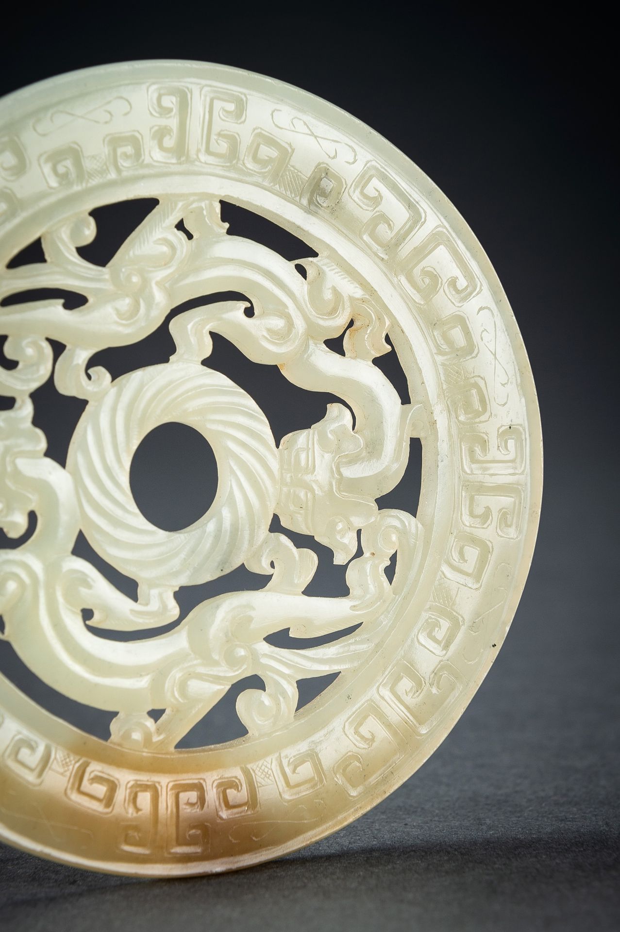 AN ARCHAISTIC YELLOW JADE RETICULATED 'CHILONG' BI DISC, QING - Image 11 of 15