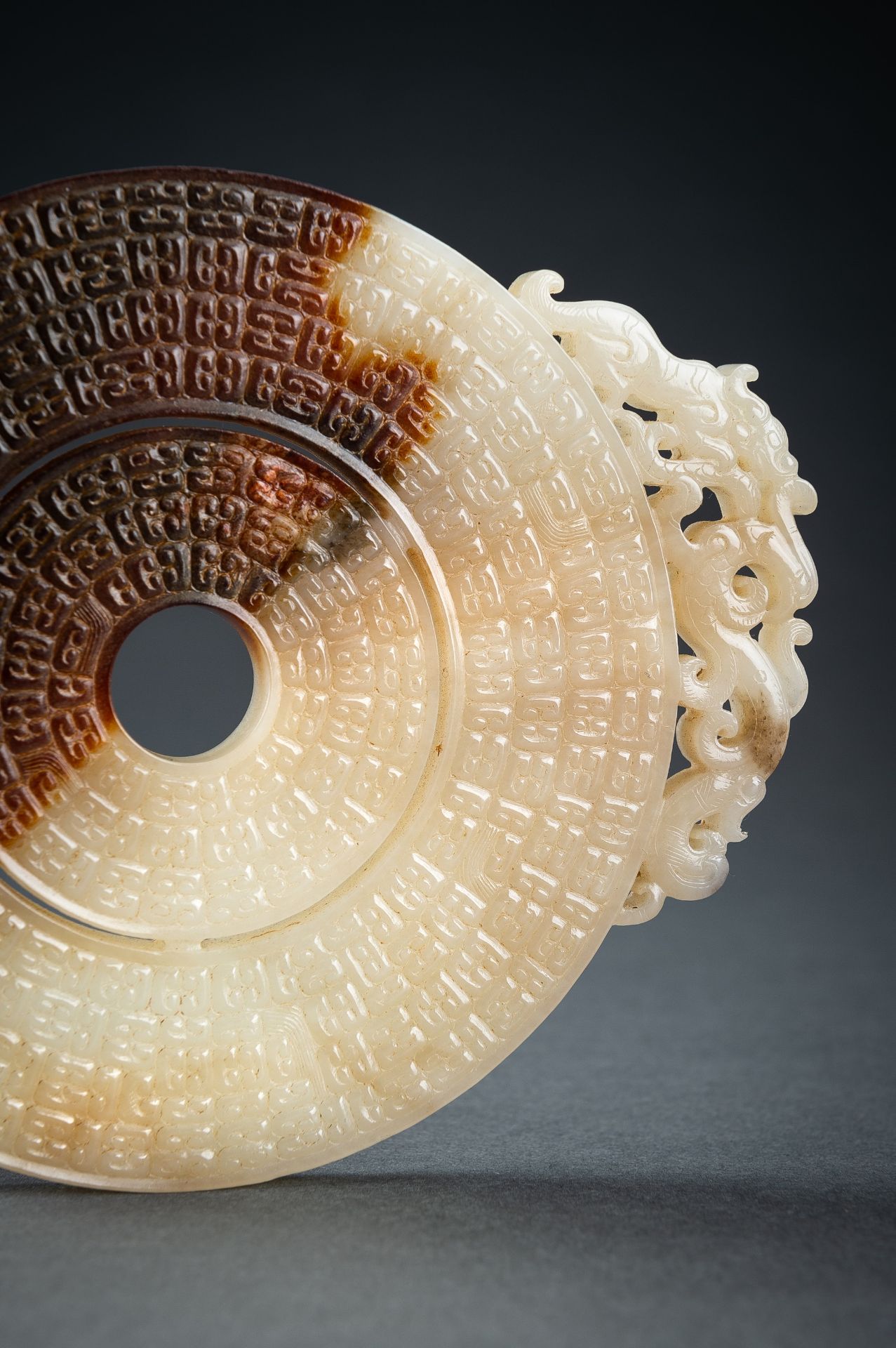 AN ARCHAISTIC WHITE AND BROWN JADE DOUBLE BI DISC, QING - Image 10 of 15