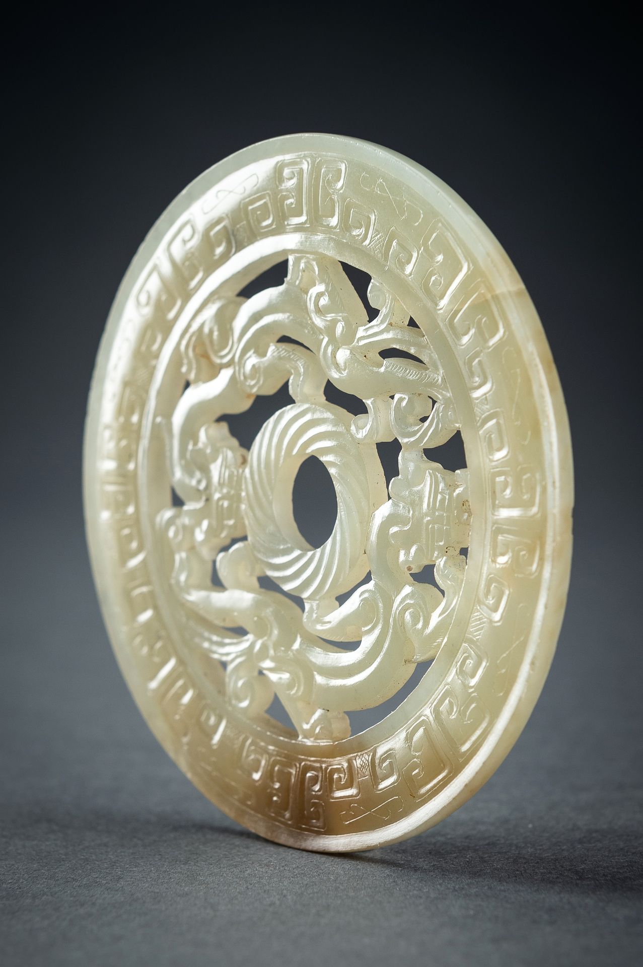 AN ARCHAISTIC YELLOW JADE RETICULATED 'CHILONG' BI DISC, QING - Image 8 of 15