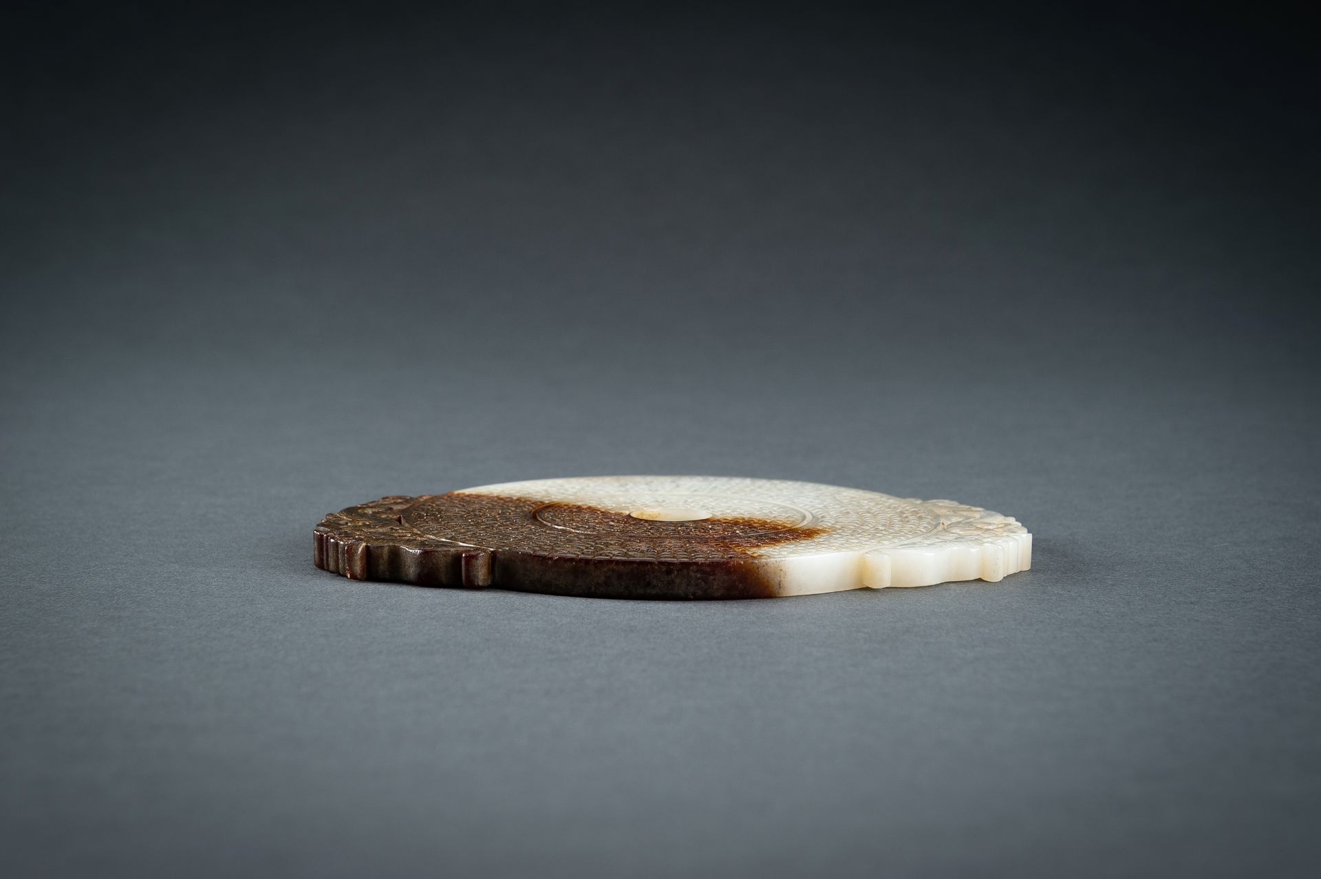 AN ARCHAISTIC WHITE AND BROWN JADE DOUBLE BI DISC, QING - Image 15 of 15