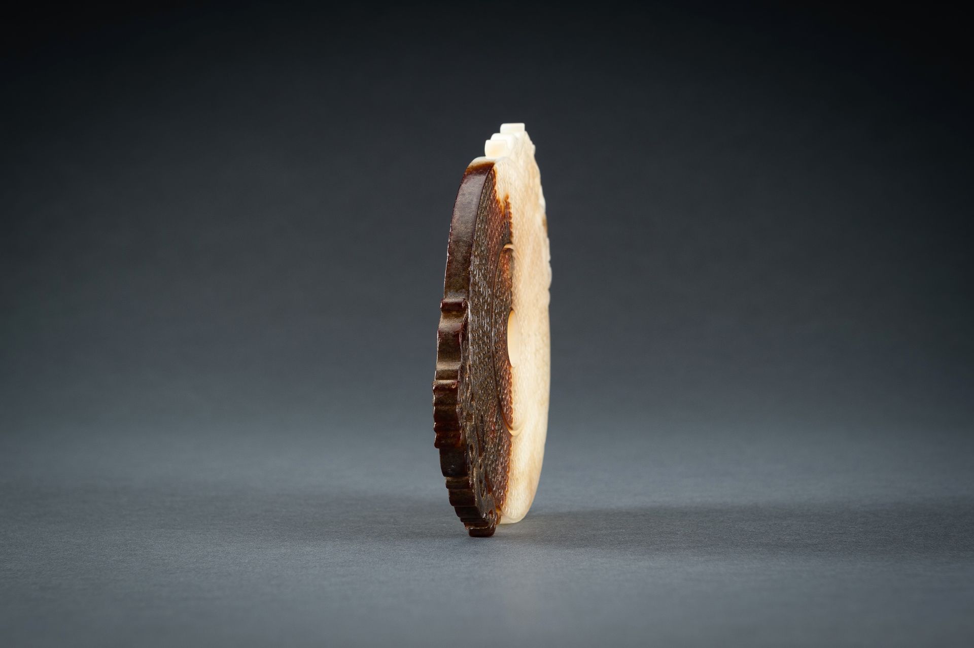 AN ARCHAISTIC WHITE AND BROWN JADE DOUBLE BI DISC, QING - Image 13 of 15