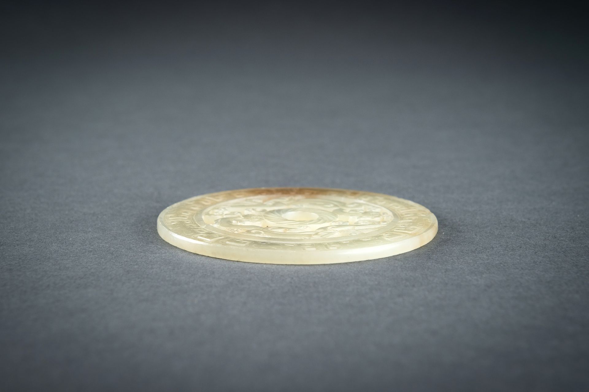 AN ARCHAISTIC YELLOW JADE RETICULATED 'CHILONG' BI DISC, QING - Image 13 of 15